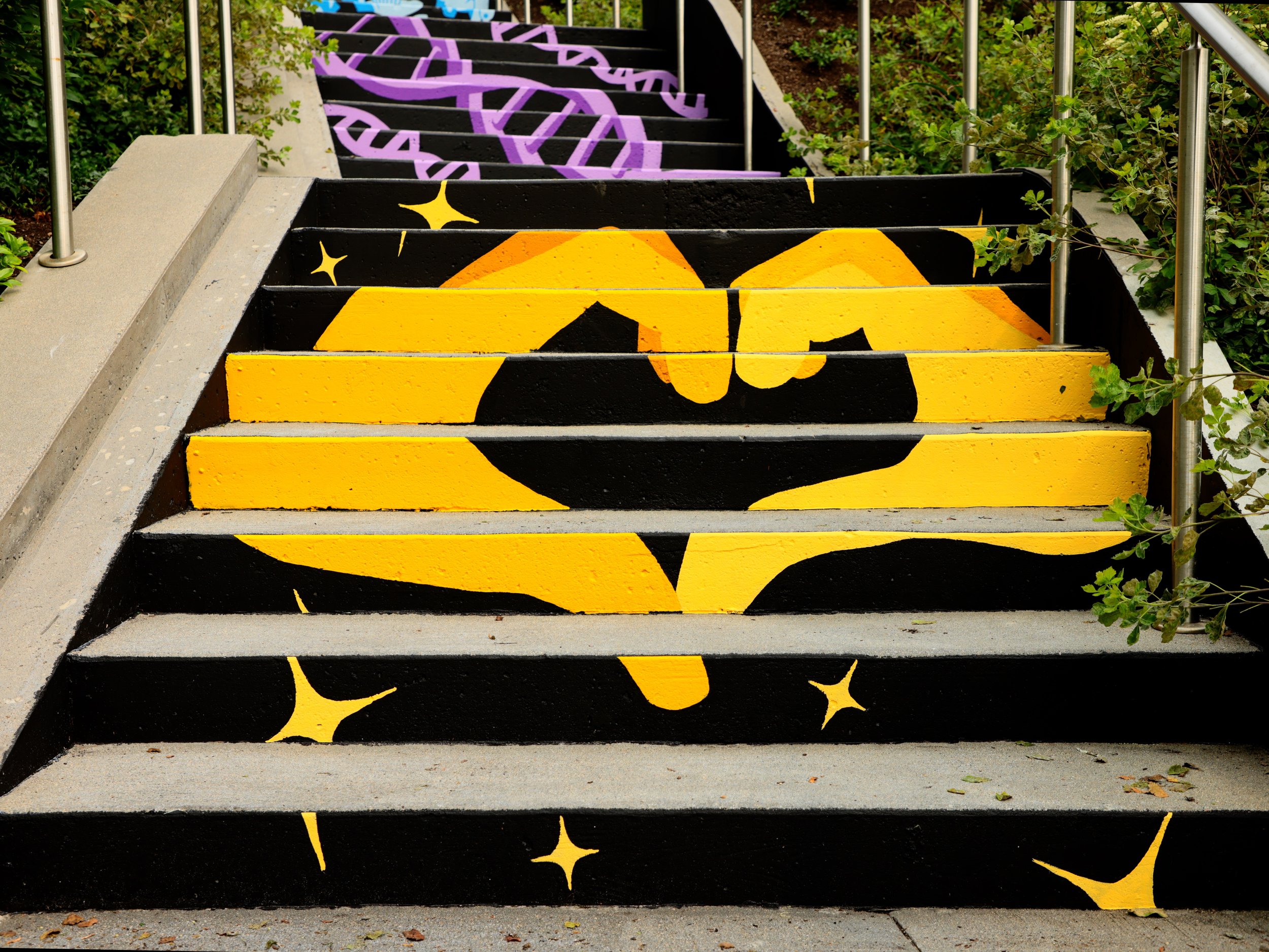  Image crediting: Michael Talbot &amp; Phoebe Warner,  Collective Ascension , 2023. Site-specific mural. Brian P. Murphy Memorial Staircase, Cambridge, MA. Project executed in collaboration with Community Art Center and facilitated by art_works for D