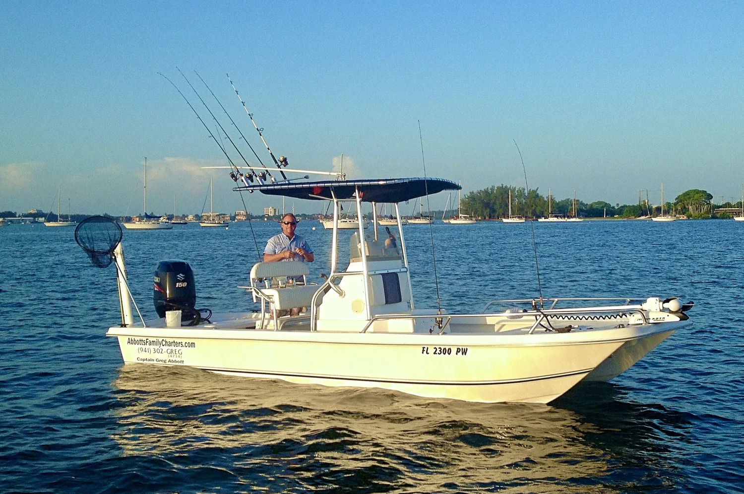 Abbott's Family Charters boat and family fishing guests on Sarasota Bay near Lido Key.