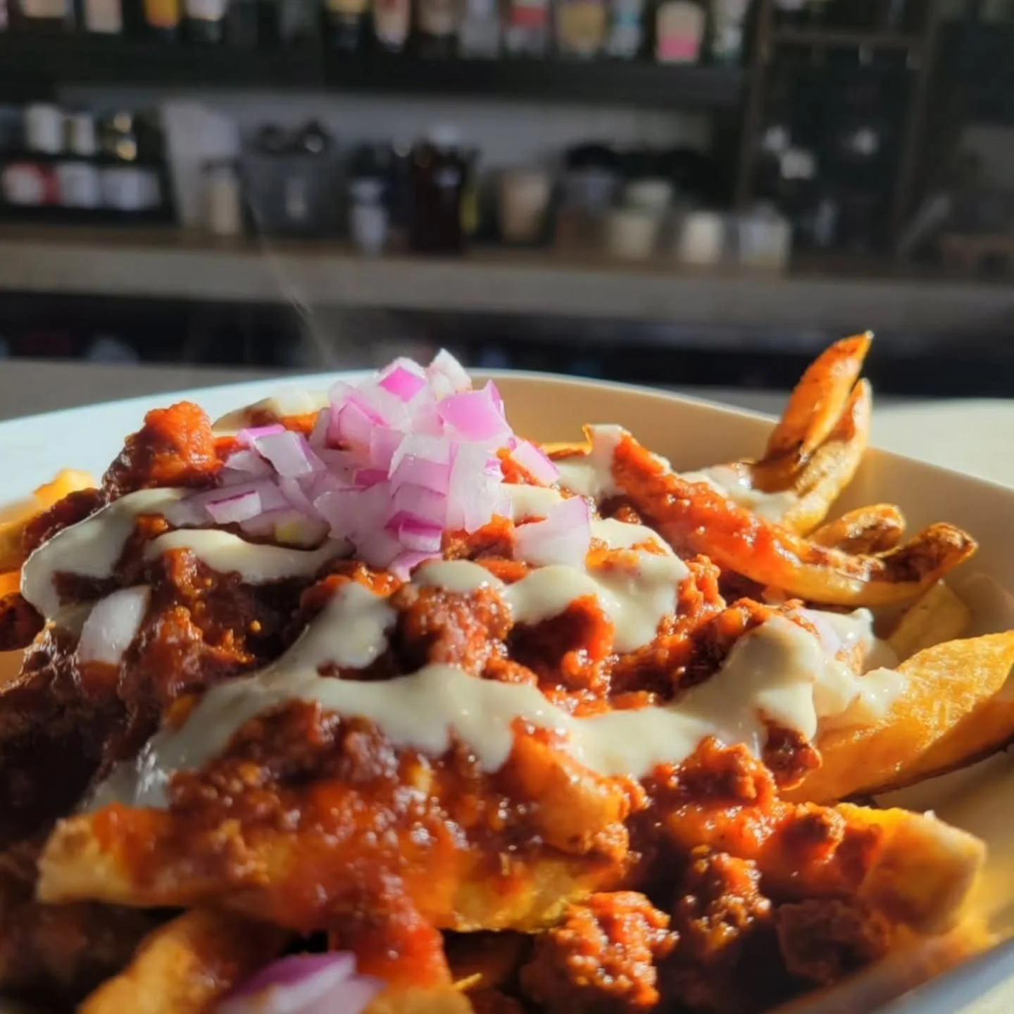 It's the last week!
Our March #poutineforthepeople is Chili Cheese Poutine. 
It features a hearty beef chili gravy, horseradish mayo, and fresh red onion on top of fries and cheese curds. Think chili cheese fries meets poutine. It's the Canadian + De