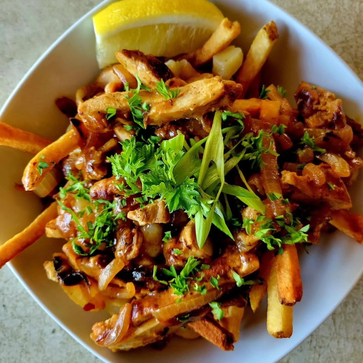 Our August #poutineforthepeople is here!
It is a Chicken Yassa Poutine created by Chef Masai May, with proceeds benefitting Heritage Works.

Chicken Yassa is considered Senegal's national dish. It features lemon marinated chicken with a caramelized o