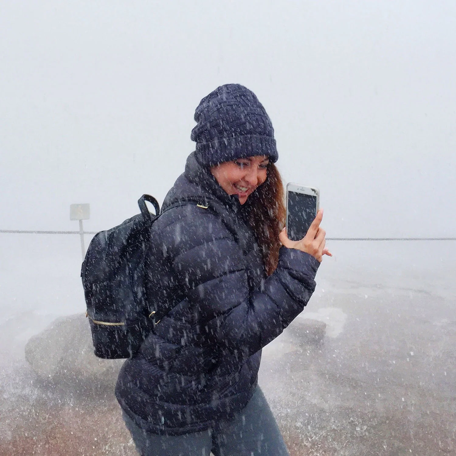 Water from the Strokkur Geysir falls on Melissa.