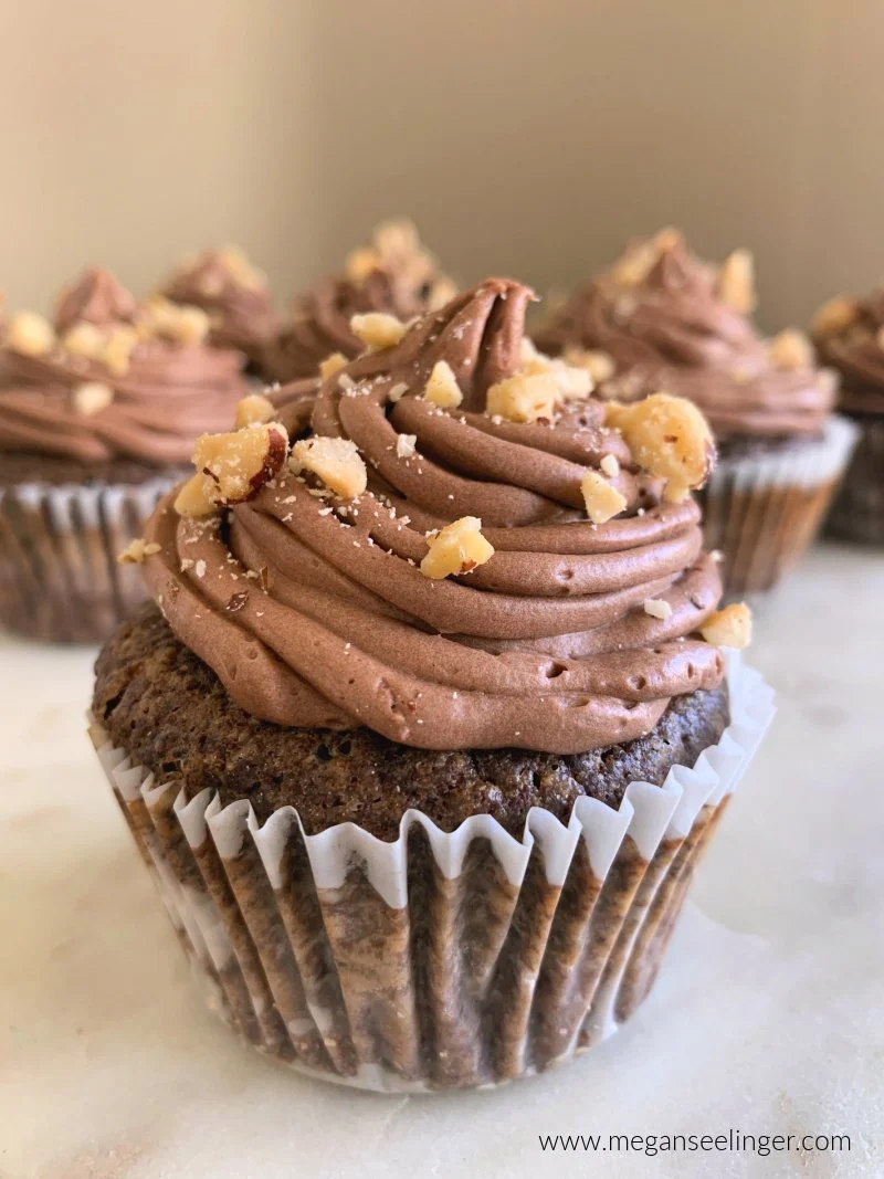 These low carb chocolate cupcakes are rich, moist, gluten free, and topped with creamy chocolate hazelnut frosting. Made with coconut flour, sugar free ingredients, they’re the perfect keto chocolate dessert