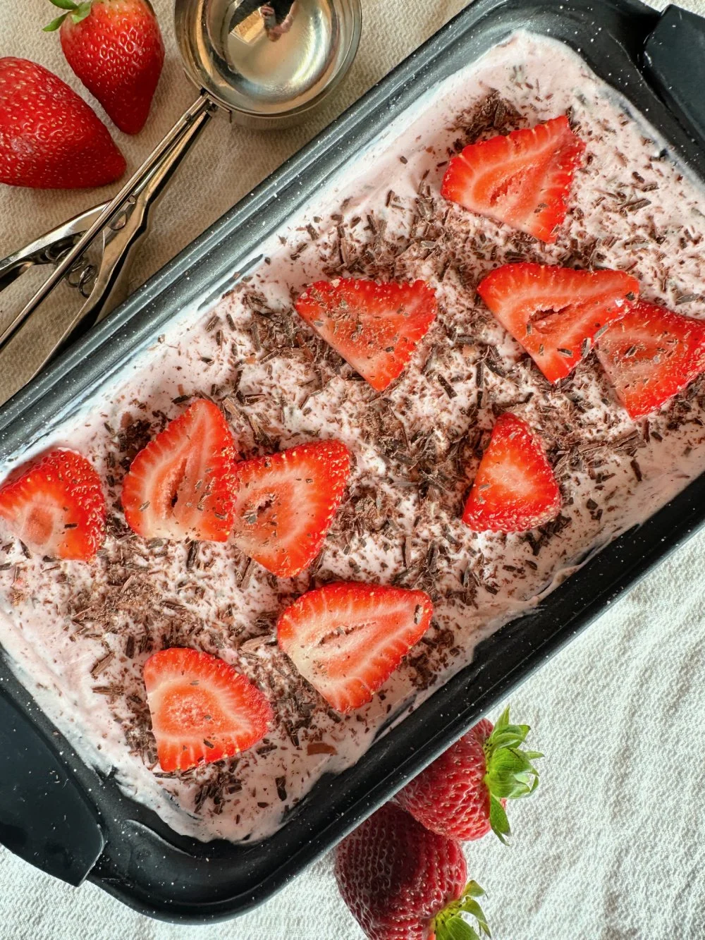 This high protein strawberry cottage cheese ice cream has shaved sugar-free dark chocolate, no ice cream maker, and only 4 ingredients. Blends in 10 minutes, freezes in 4 hours.