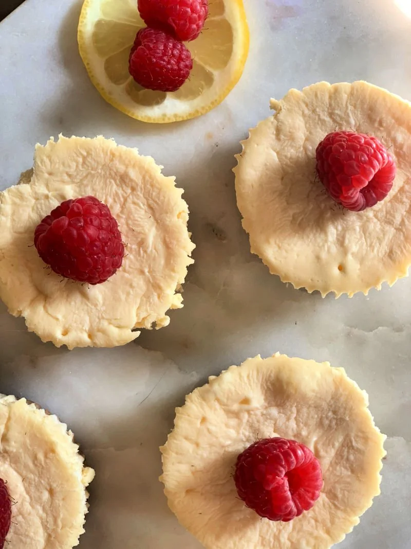 Sugar-free lemon cheesecake bites with almond flour crust on a white plate