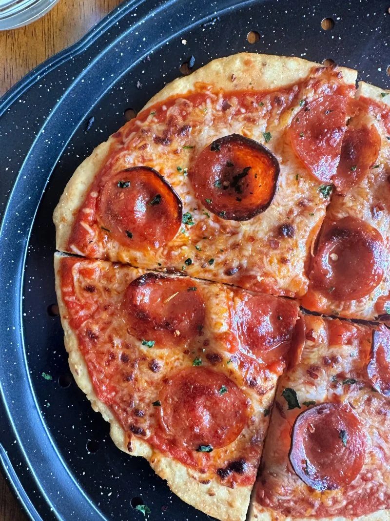 Crispy chicken crust pizza made with a gluten free high protein pizza crust that’s keto-friendly and ready in under 30 minutes.