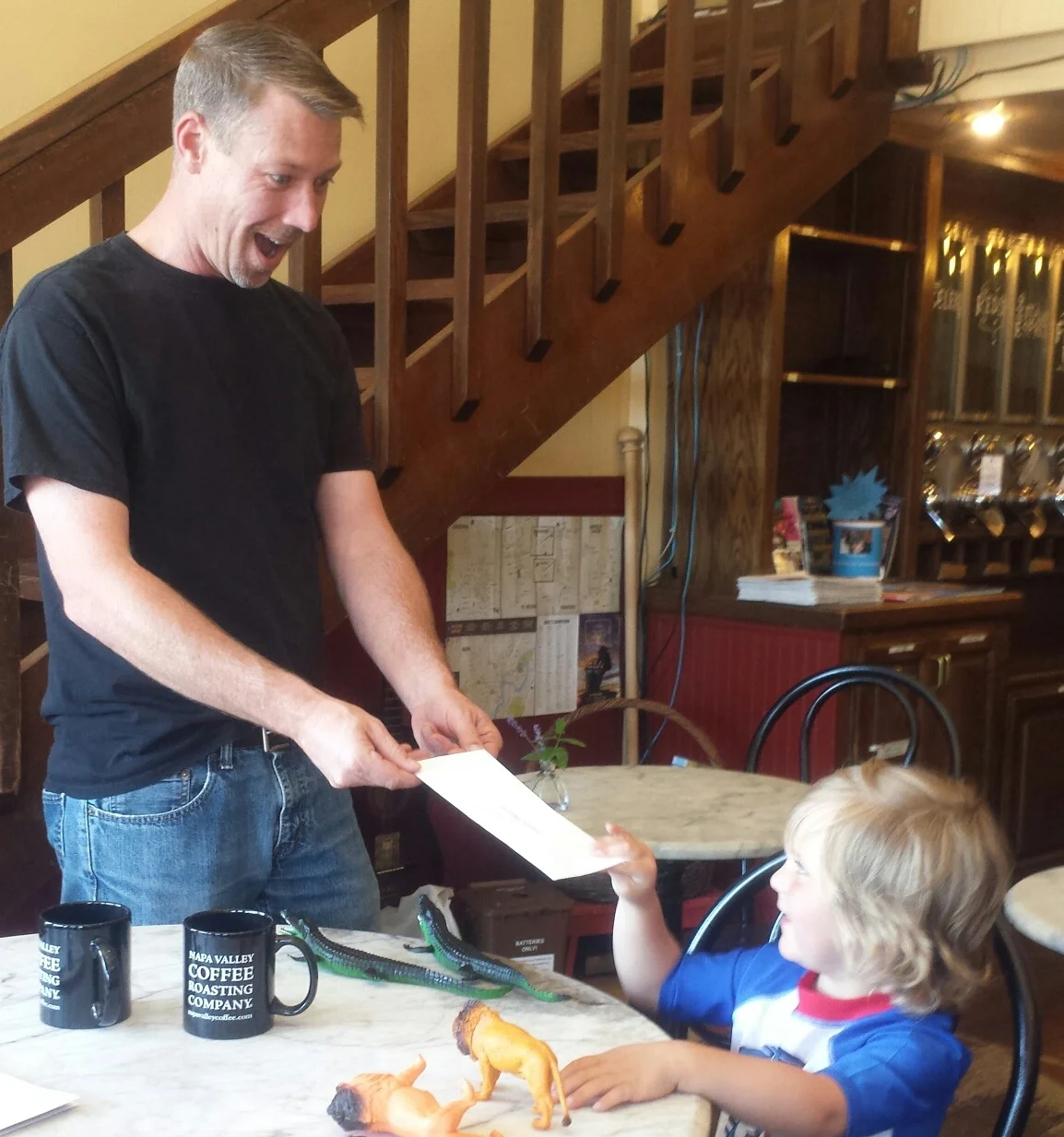We had a successful event for Gunnar! Here he is collecting a check from our June 6th Caffeinate and Donate event.