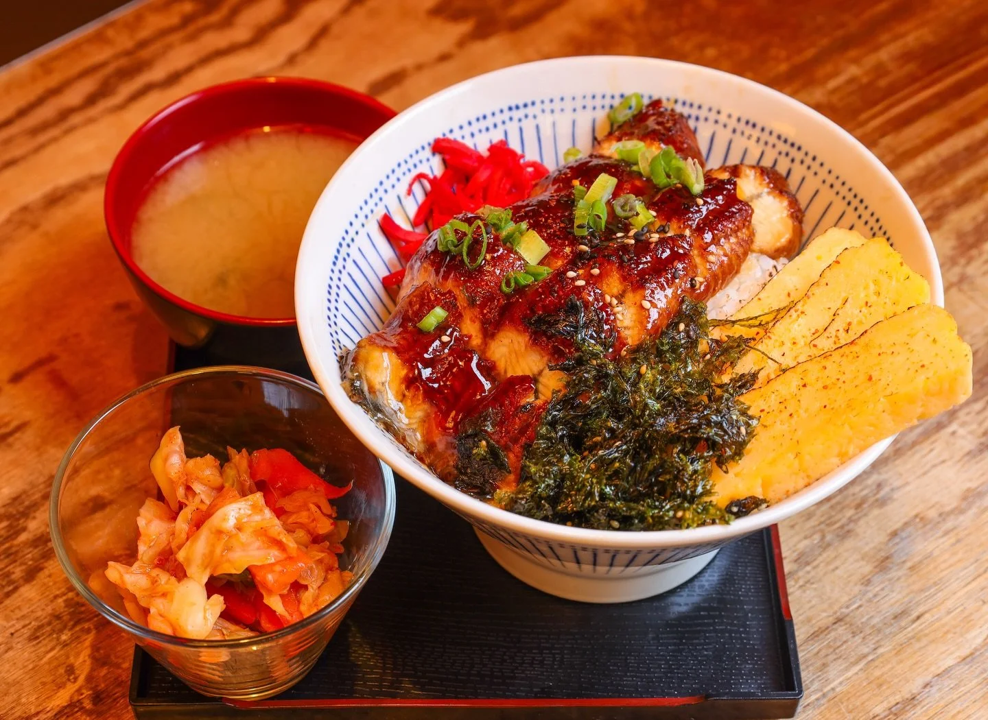 Meet your new winter comfort obsession 🍱❄️ Soul-warming, cozy, and perfect for cold days &mdash; our NEW Unagi Rice Bowl just dropped.
Grilled unagi over steamed white rice, topped with tamago cake, scallions, ginger, and crispy seaweed. Served with