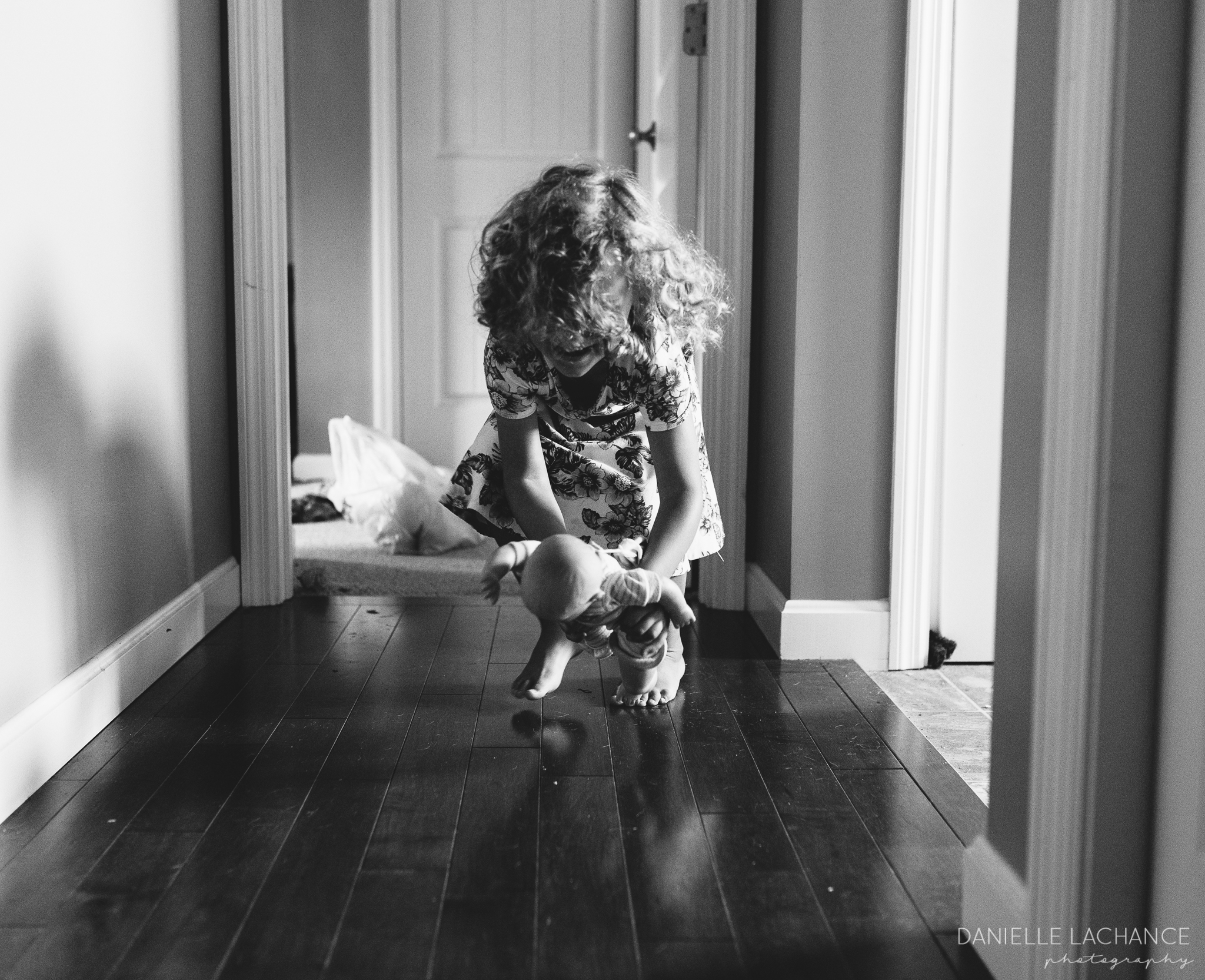 Abby helping her baby run through the hallway