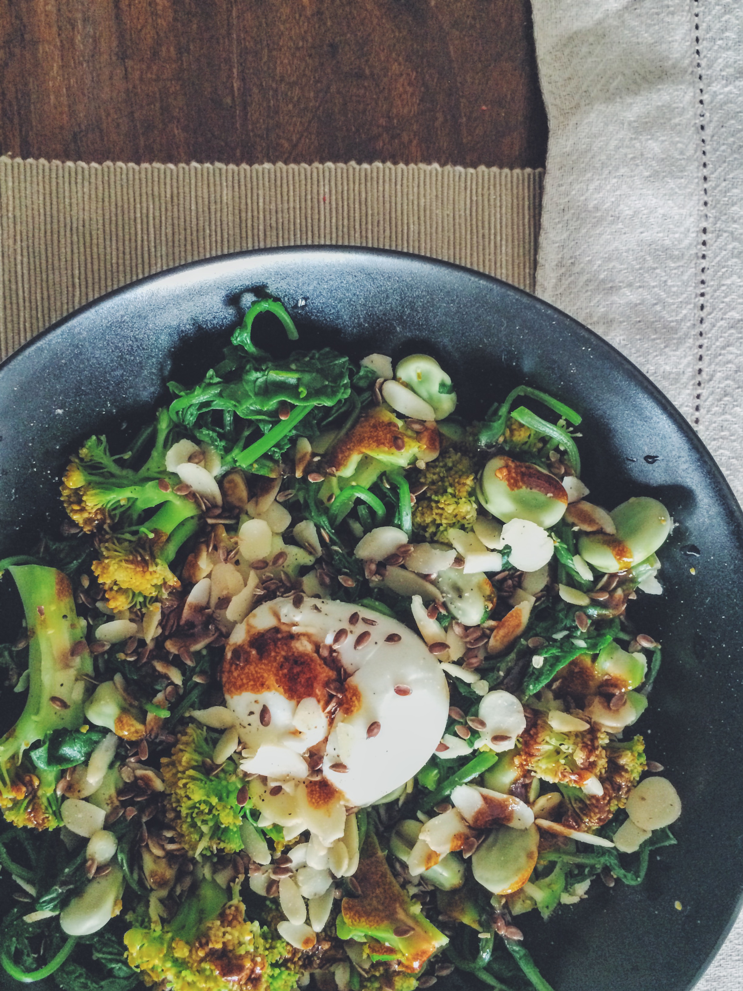 oeuf mollet, fava beans, greens and seeds