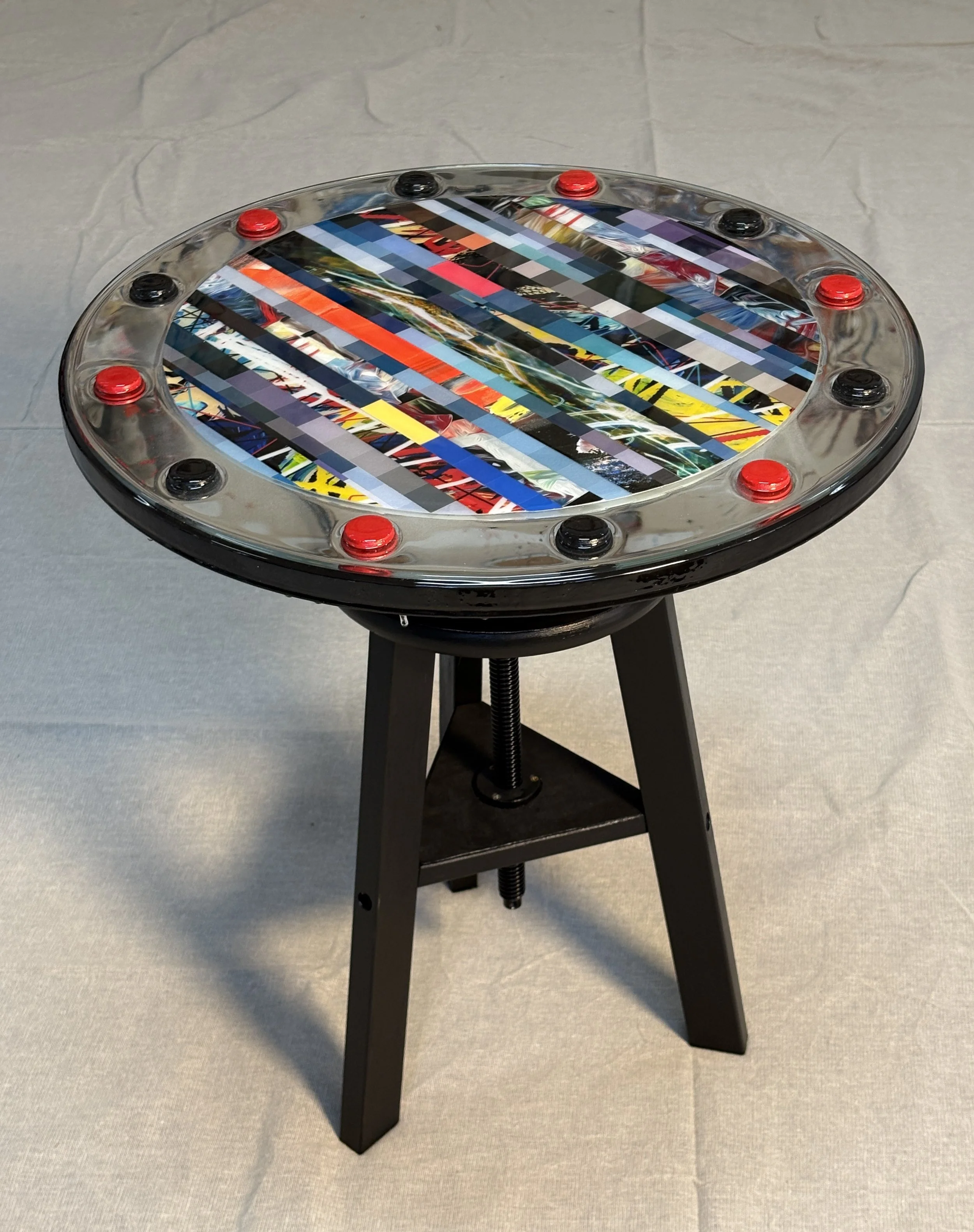  Sculpture or side table, it’s up to you. 20” dia. top with epoxied collage on mirror. Adjustable height. One of a kind. 