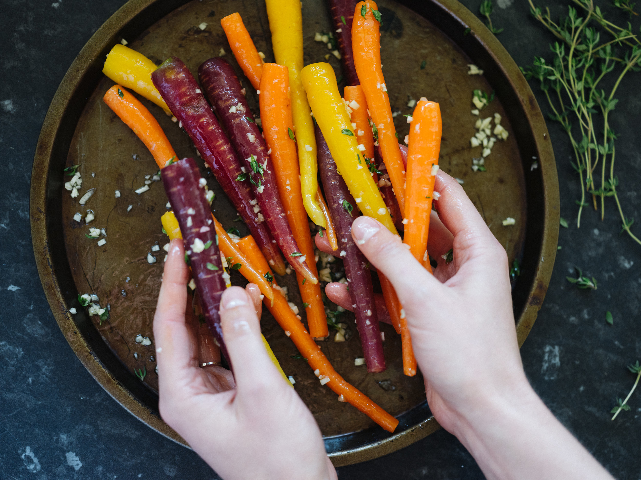 Rub seasoning into the carrots.