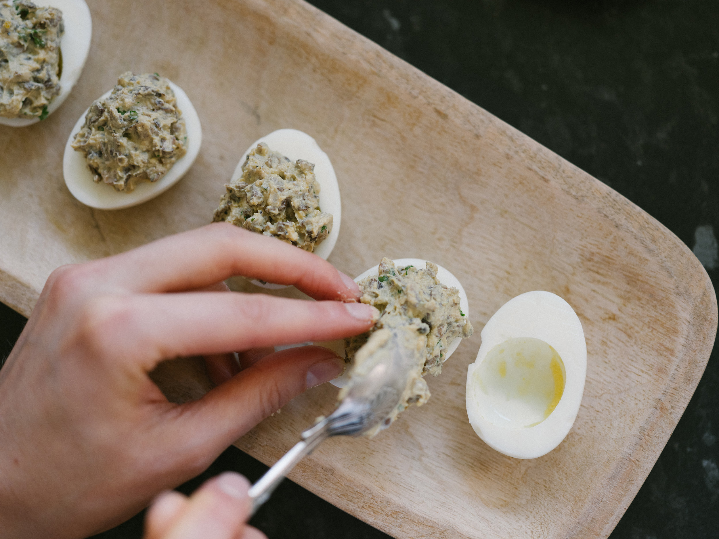 Once it's all mixed, fill the egg white halves with as much filling as you like.