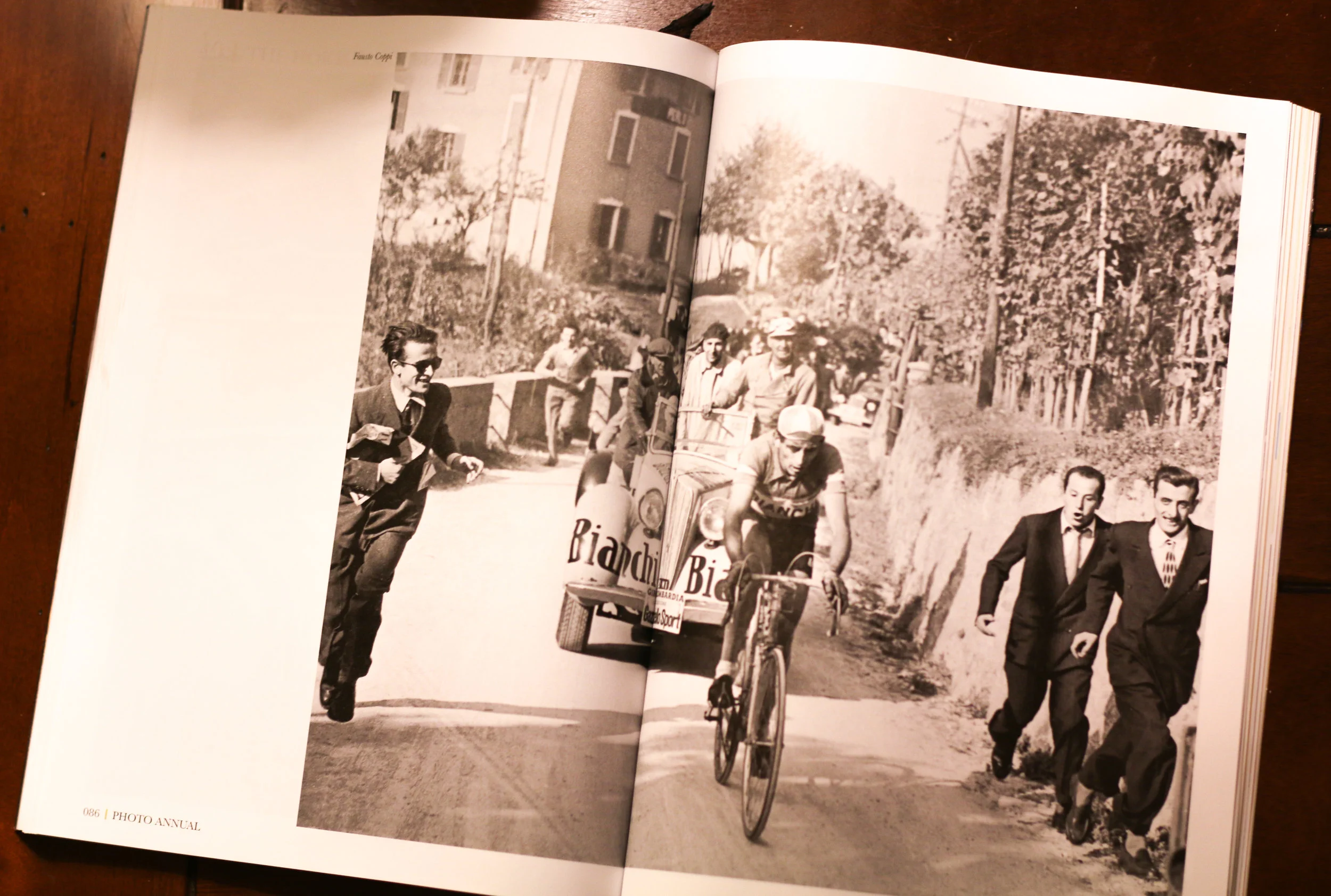 Fausto Coppi racing in the Giro di Lombardia with Hotel Il Perlo in the backround. Today you can still watch amateurs and pros make the climb to the Ghisallo. From the 2015 Peloton Magazine Photo Annual.