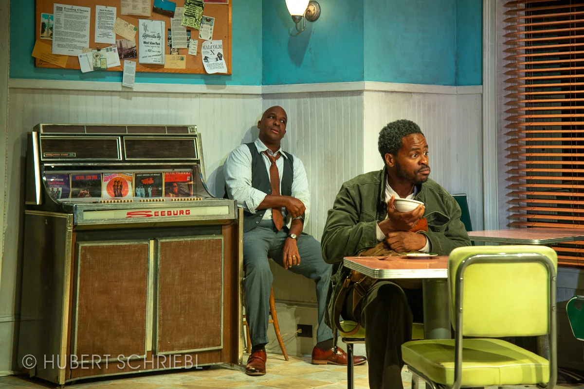 The Jukebox for the show was sourced from a garage in Berkshire County MA and refurbished for the production. The cracked glass facade was replaced by heating and clamping plexiglass into shape.