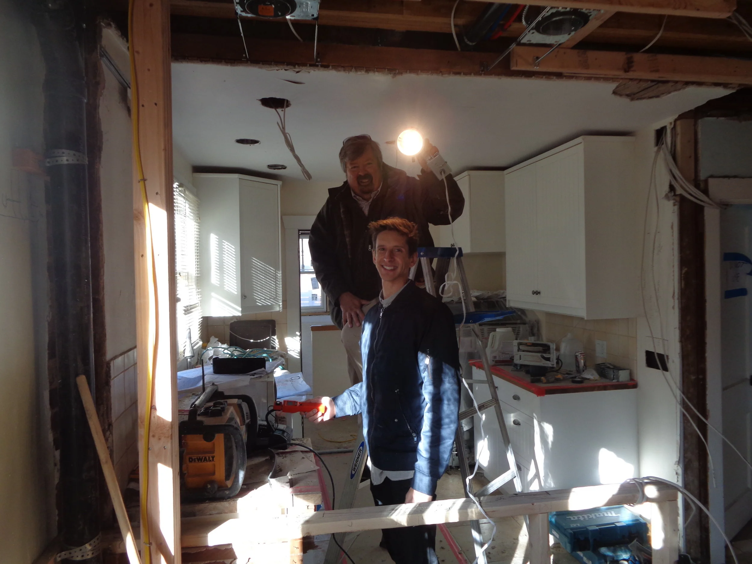 Client Mike Flaherty and I show how we measured four different lamp types at five different locations overhead in his remodeled Congress Park kitchen the night before (you need dark!)