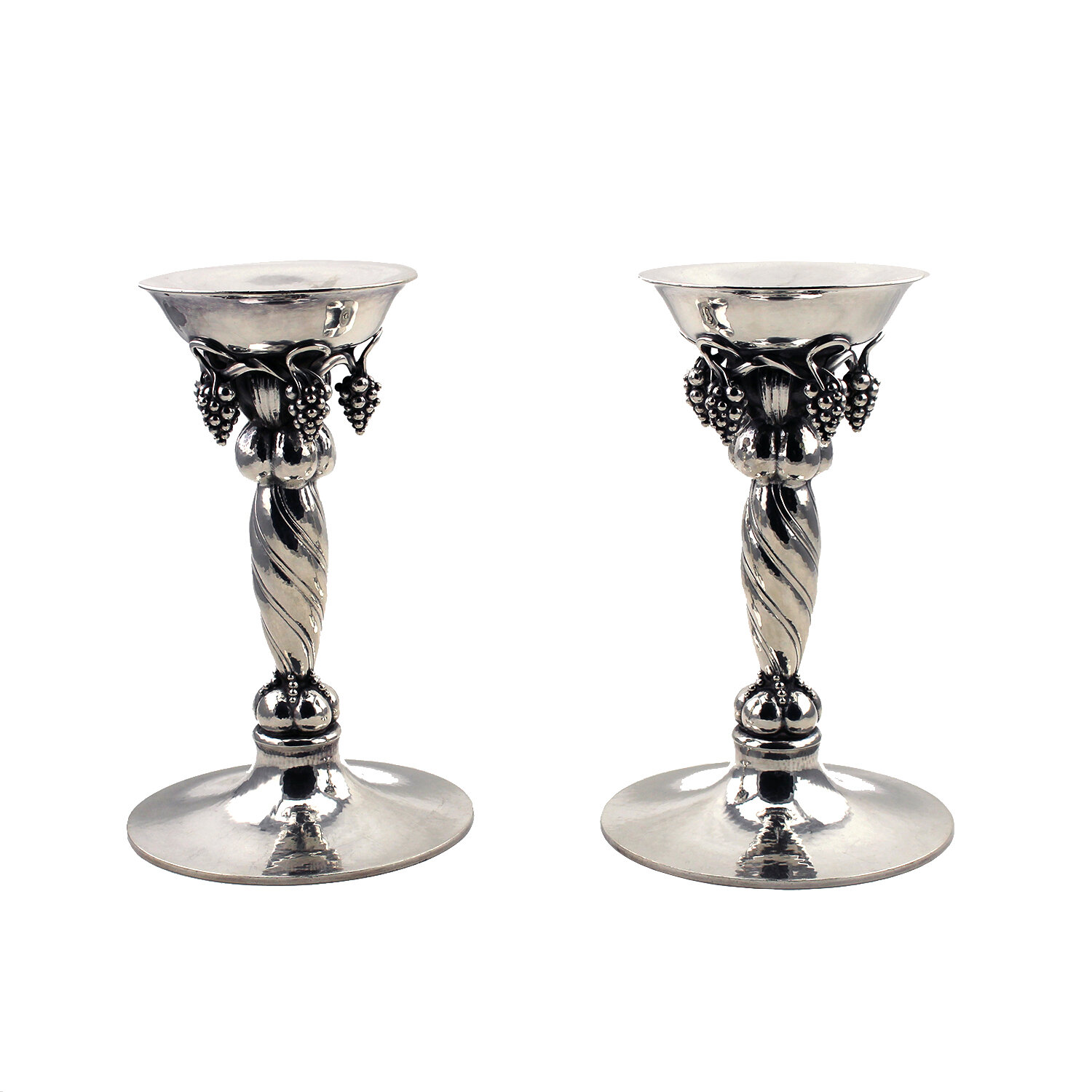 Georg Jensen (Danish 1866-1935) Pair of Grape Pattern Sterling Silver Candlesticks, Circa 1930