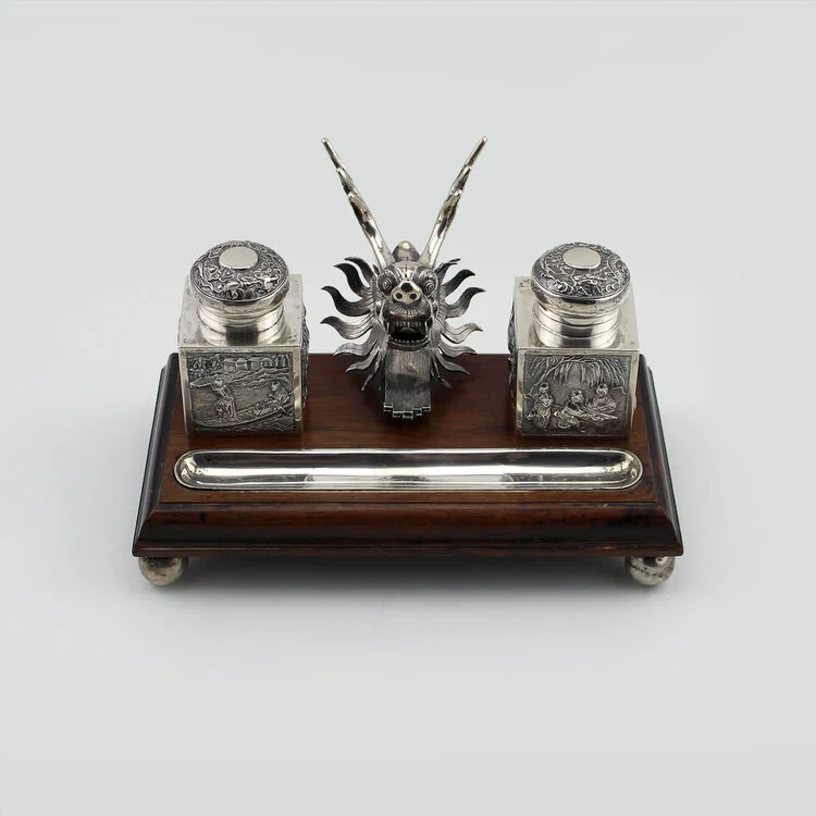 Chinese sterling ink well with two pots and dragon's head mounted on a wooden base, circa 1880. Size: 4 ¾ h x 9 ¾ w x 4 ½ d in