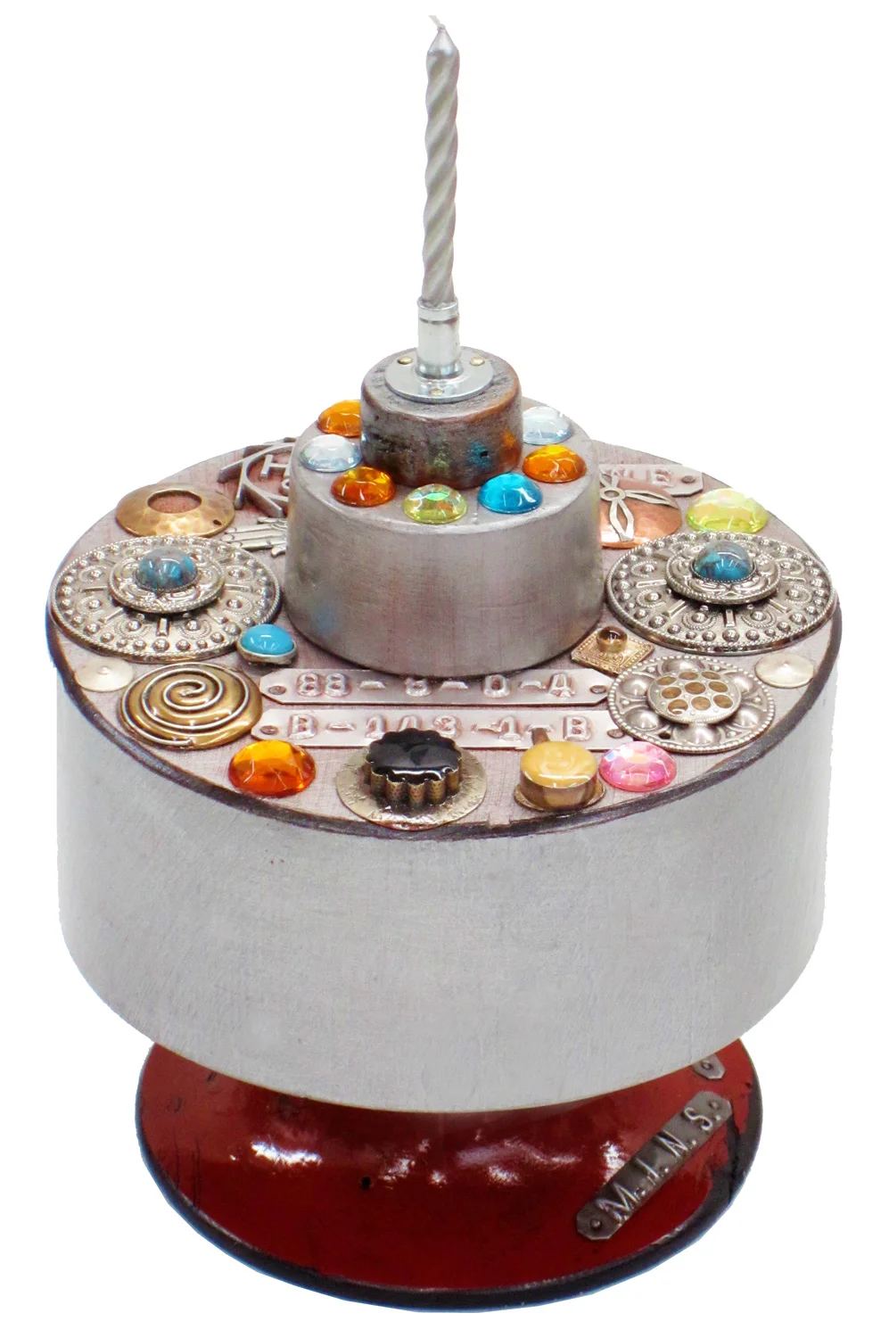 Bedazzled birthday cake, reclaimed materials sculpture, 7" x 6" x 6"