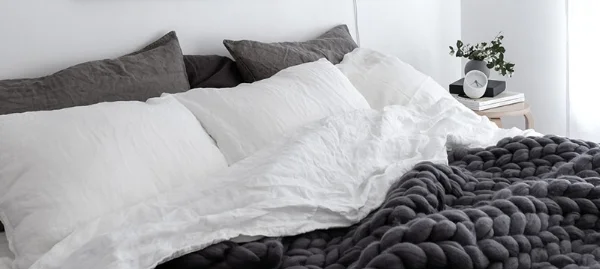 Scandinavian-style-bedroom-with-linen-bedding-Ohhio-chunky-merino-wool-blanket-and-Rainy-Day-print-by-Anu-Tammiste-1.jpg