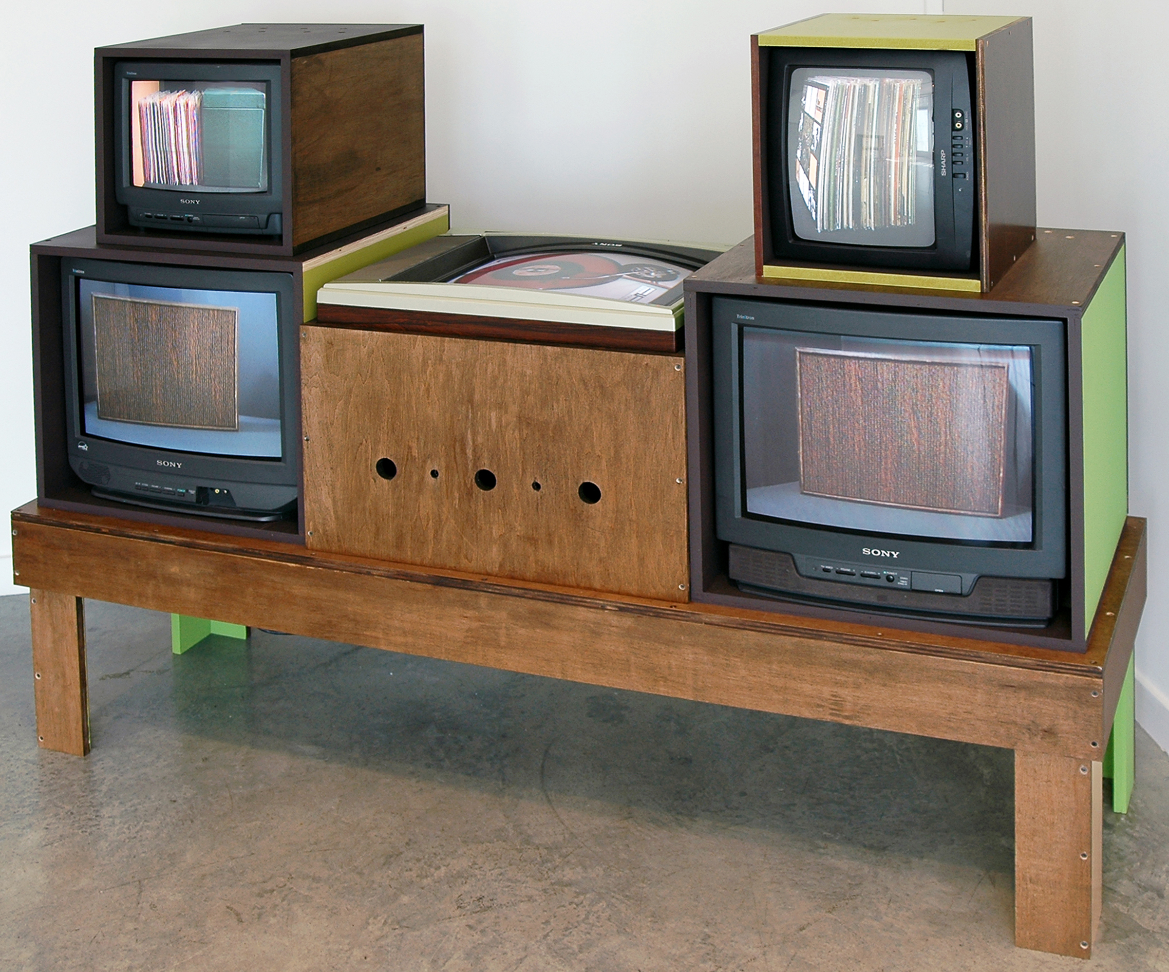JOSHUA PIEPER Video Stereo , CRT monitors, RF modulators, DVD players, plywood and paint, 54" x 72" x 22", 2012