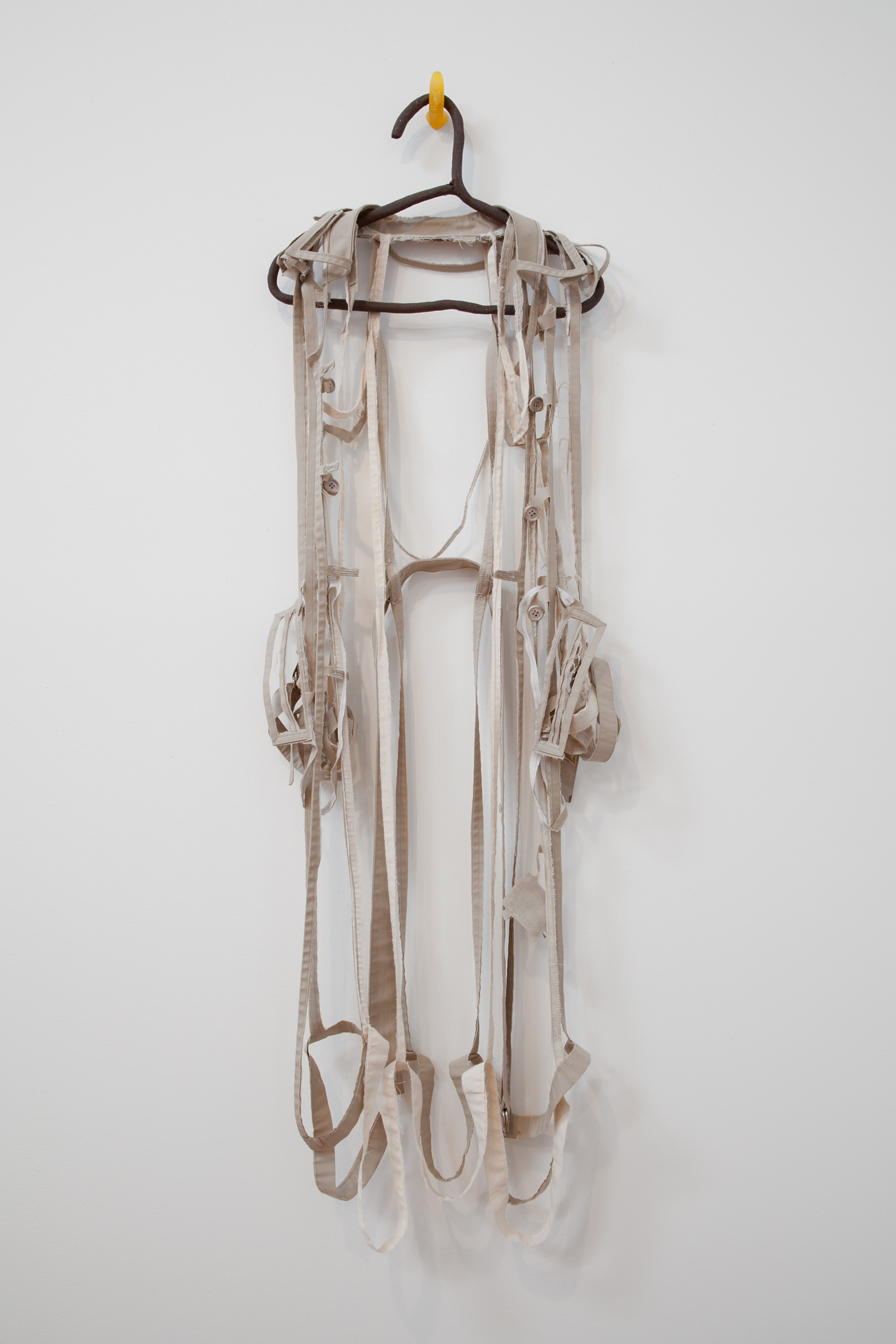   ANNA SEW HOY   beige/cream , fired stoneware, trench coat and resin finger hook, 55" x 17" x 3.5", 2012 