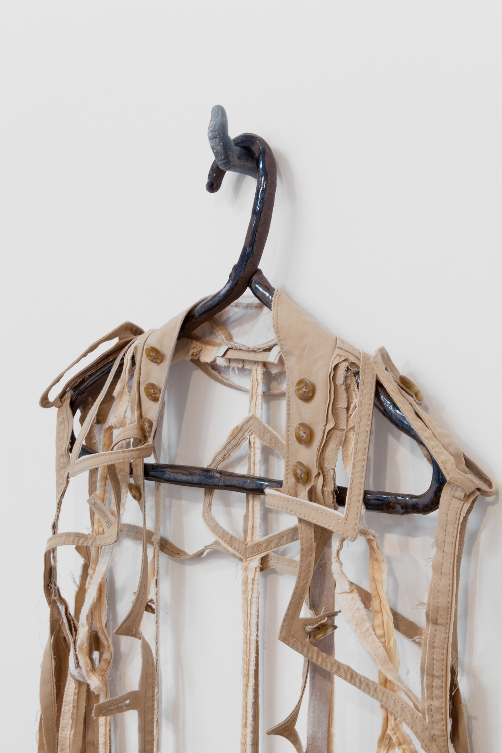   ANNA SEW HOY  (detail)  beige/tan , fired stoneware, trench coat and resin finger hook, 62.5" x 17" x 4", 2012 