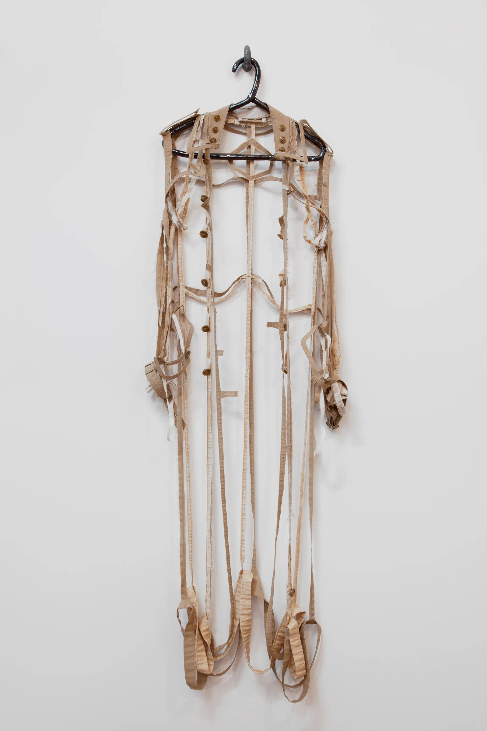 ANNA SEW HOY beige/tan , fired stoneware, trench coat and resin finger hook, 62.5" x 17" x 4", 2012