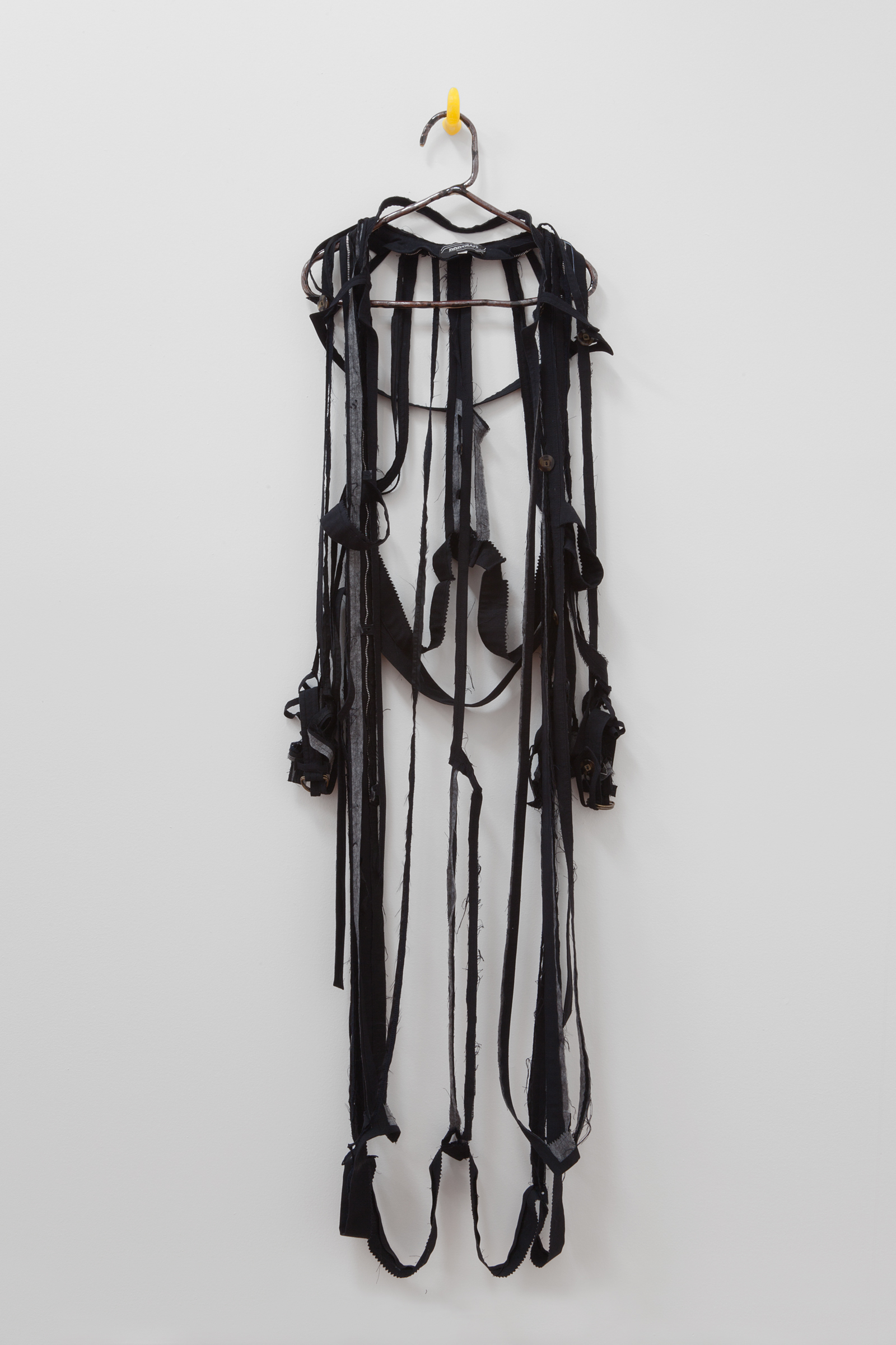   ANNA SEW HOY   black/noire , fired stoneware, trench coat and resin finger hook, 62.5" x 16.5" x 4", 2012 