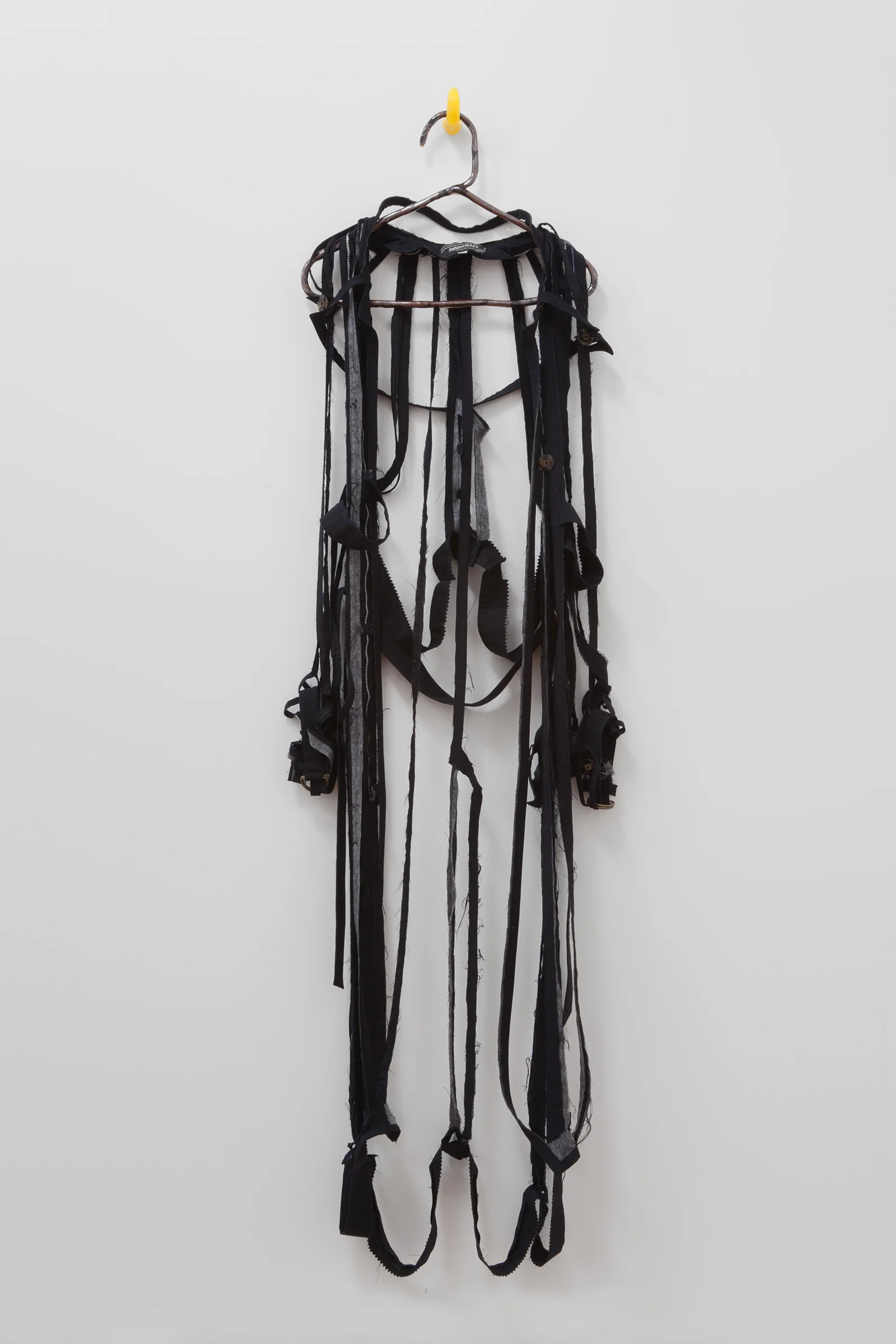 ANNA SEW HOY black/noire , fired stoneware, trench coat and resin finger hook, 62.5" x 16.5" x 4", 2012