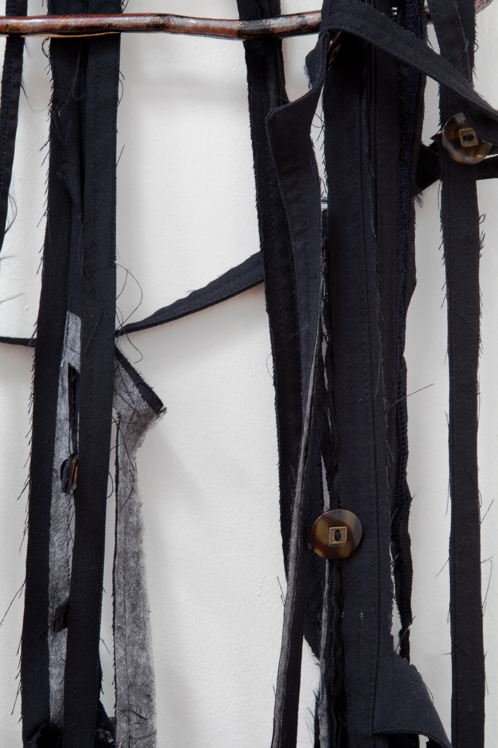   ANNA SEW HOY  (detail)&nbsp; black/noire , fired stoneware, trench coat and resin finger hook, 62.5" x 16.5" x 4", 2012 