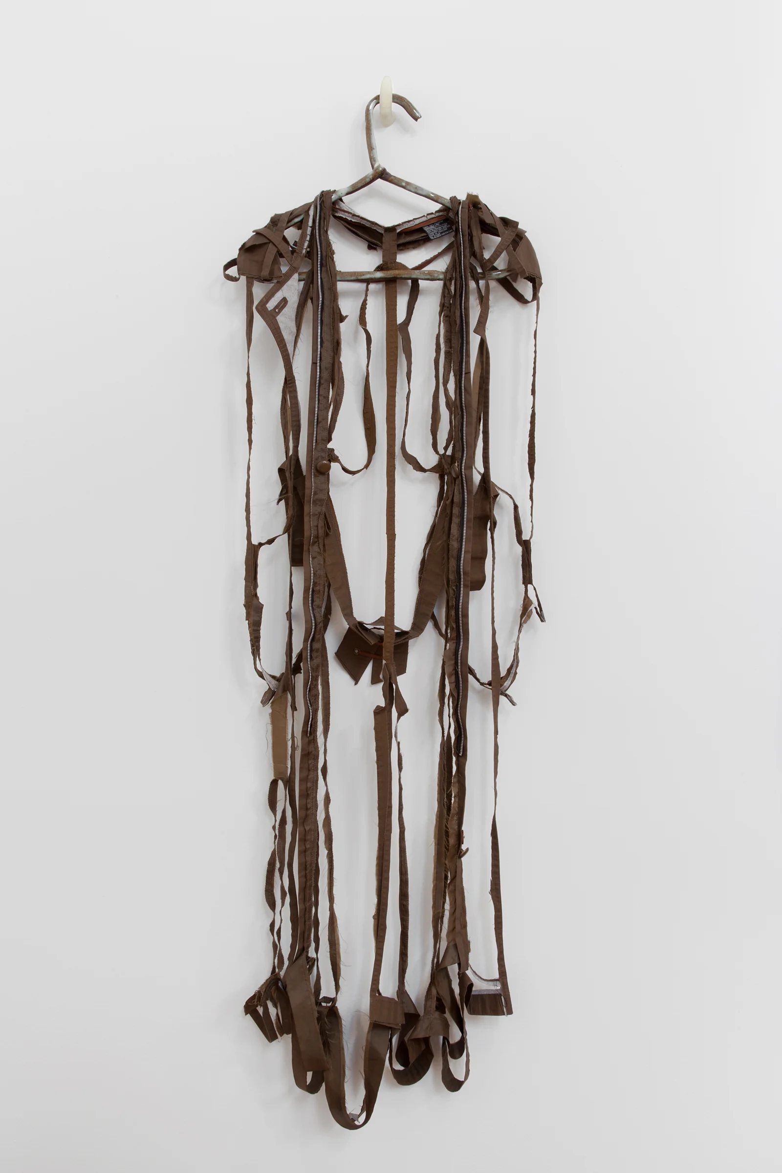 ANNA SEW HOY chocolate/chocolat , fired stoneware, trench coat and resin finger hook, 58.5" x 18" x 3.5", 2012
