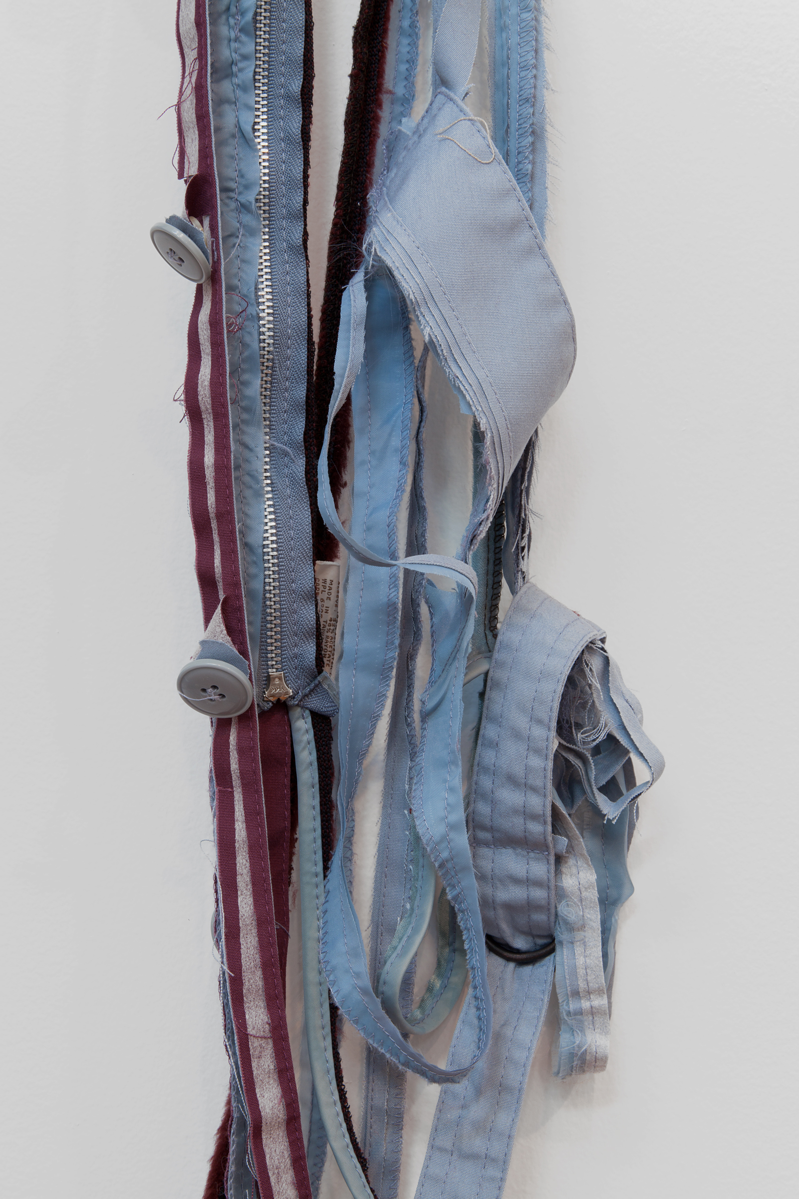   ANNA SEW HOY  (detail)  maroon/bleu lavande , fired stoneware, trench coat and resin finger hook, 58" x 18" x 4.5", 2012 