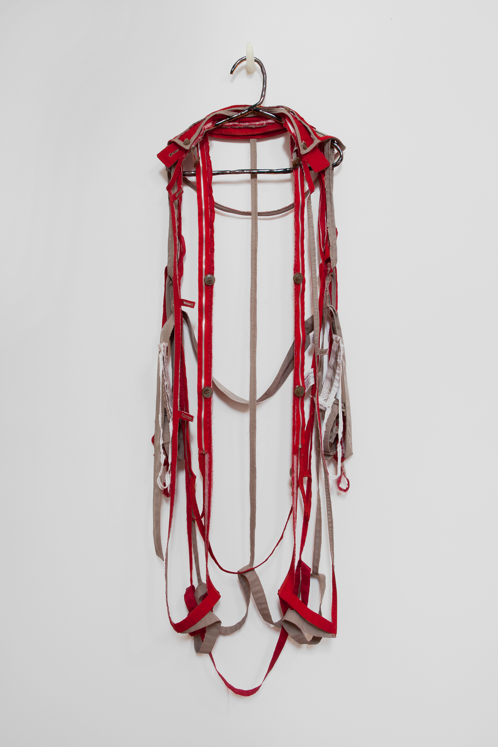   ANNA SEW HOY   rouge/tan , fired stoneware, trench coat and resin finger hook, 58" x 17" x 5", 2012 
