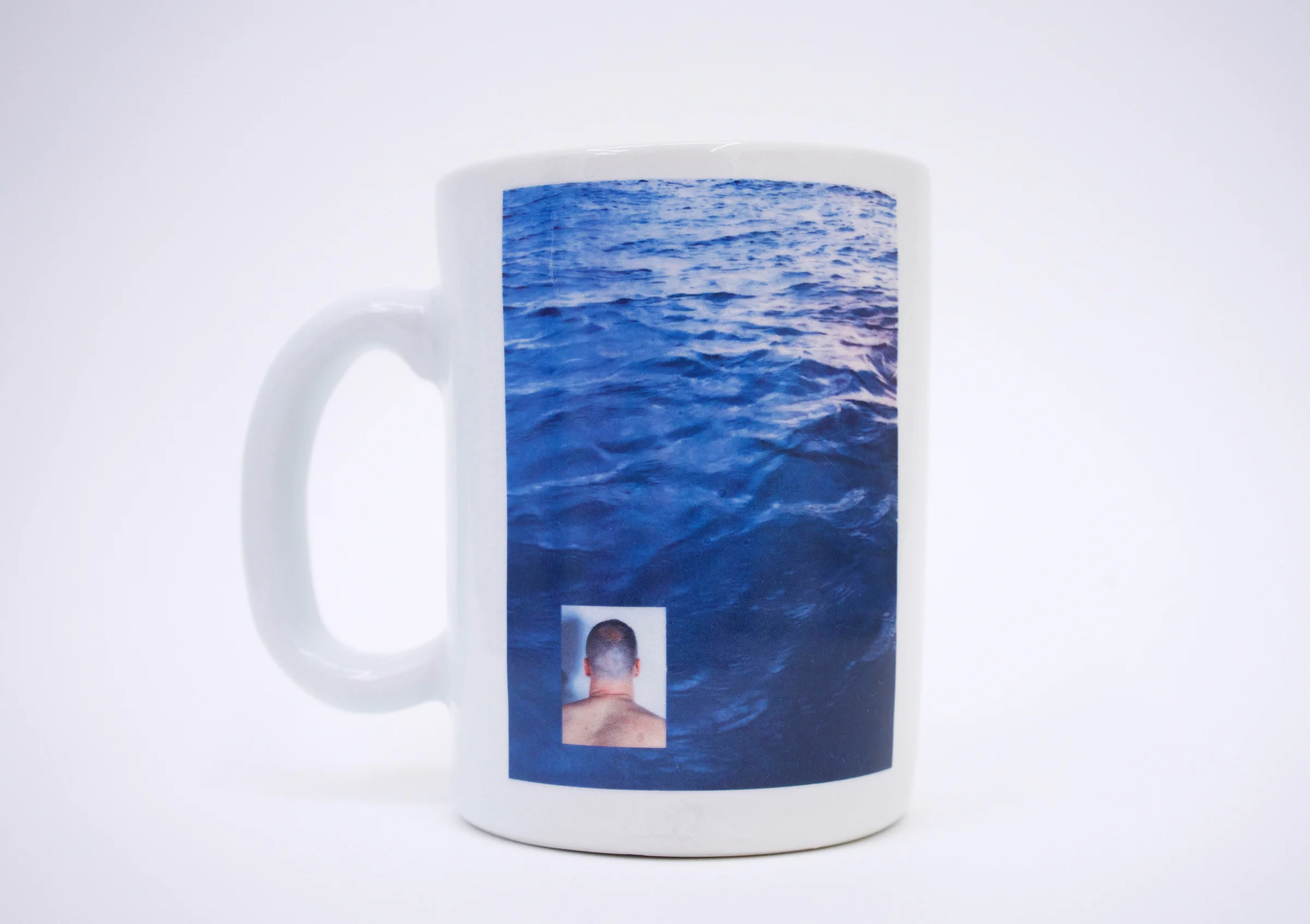 Erik Scollon (Shelf #1 detail) Mug 4: The “Should Be” of Utopia , 2018 porcelain, glaze, ceramic decal