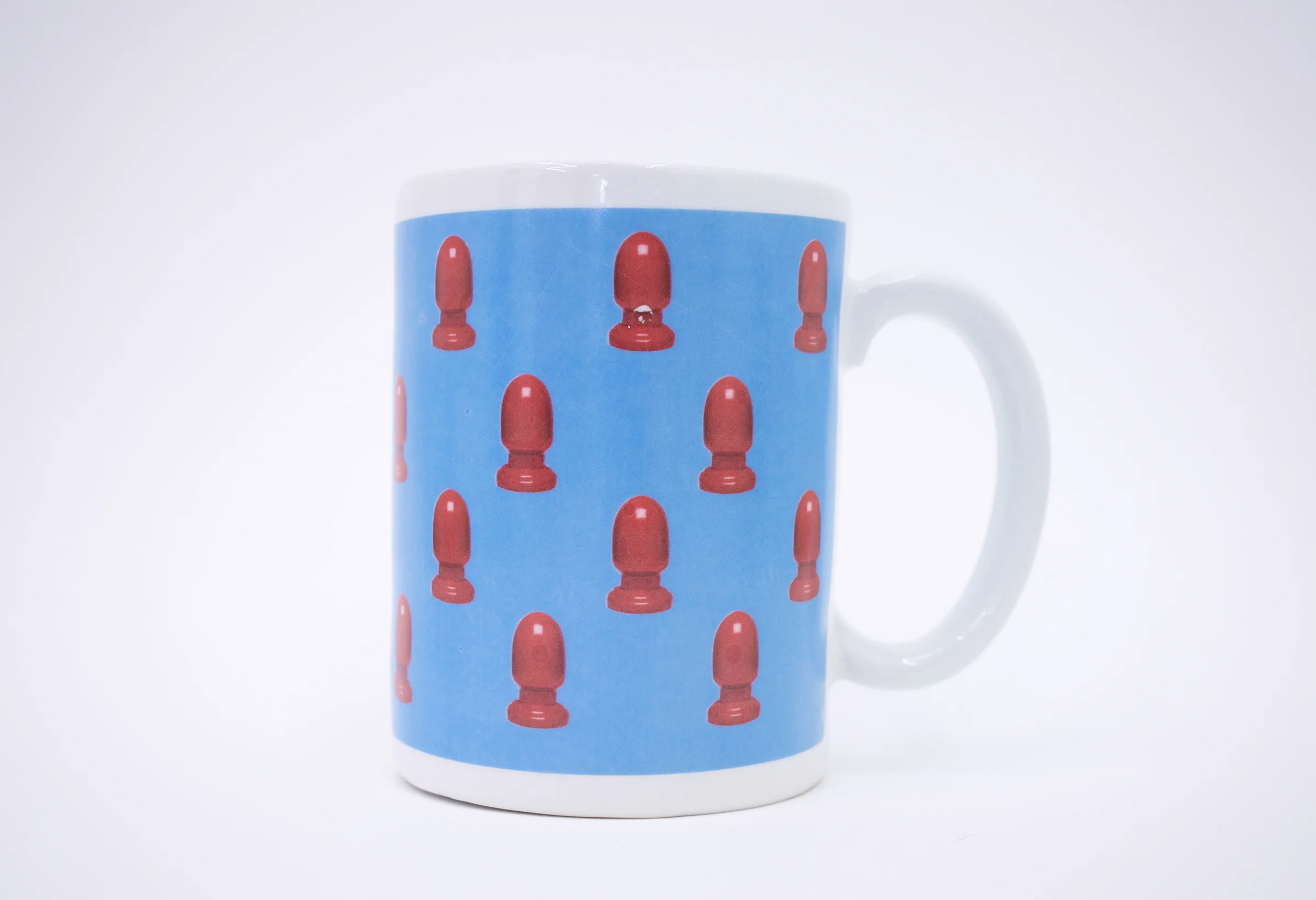 Erik Scollon (Shelf #1 detail) Mug 7: Can Be Used as a Paperweight , 2018 porcelain, glaze, ceramic decal