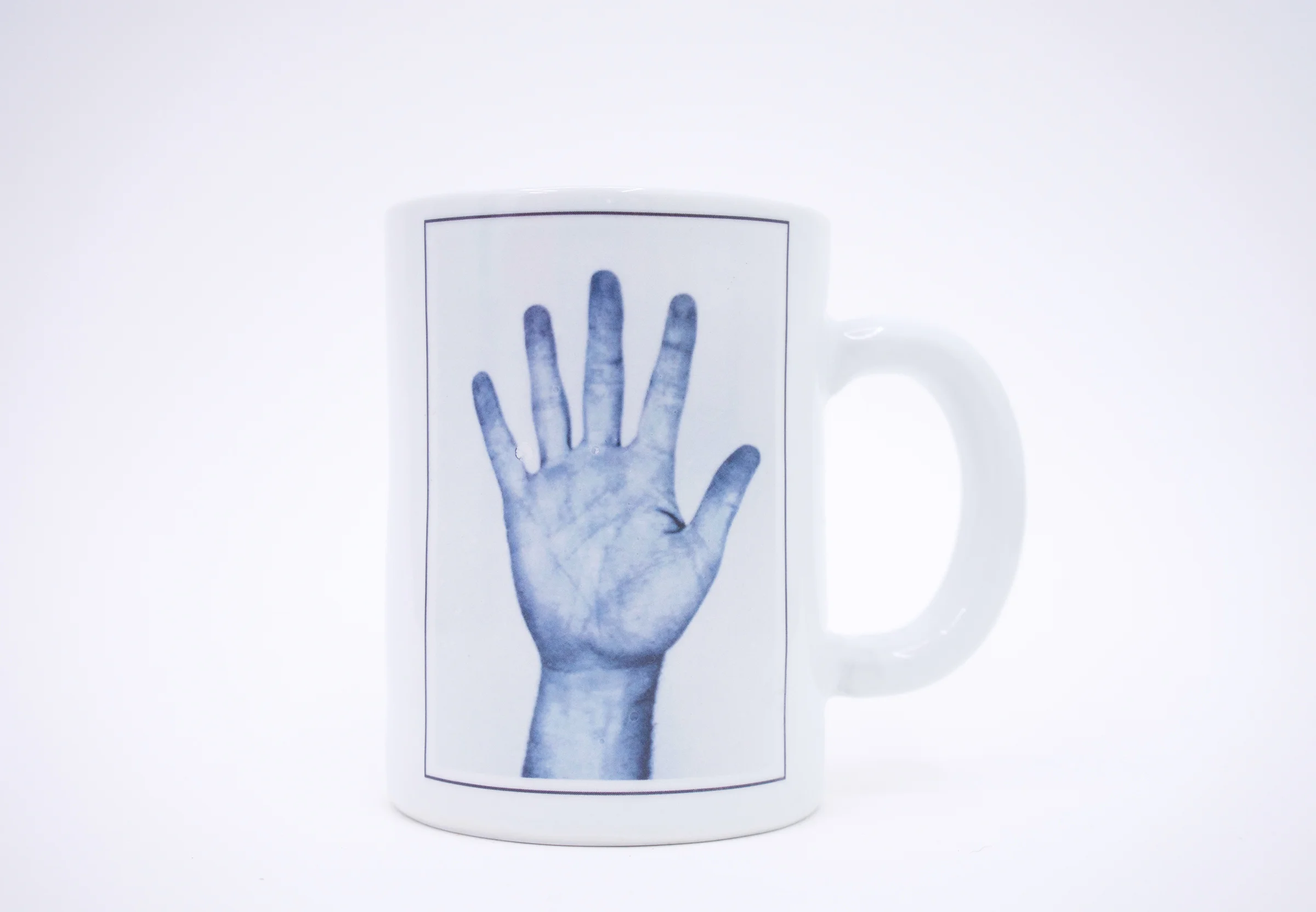 Erik Scollon (Shelf #2 detail) Mug 4: Social Studies , 2018 porcelain, glaze, ceramic decal