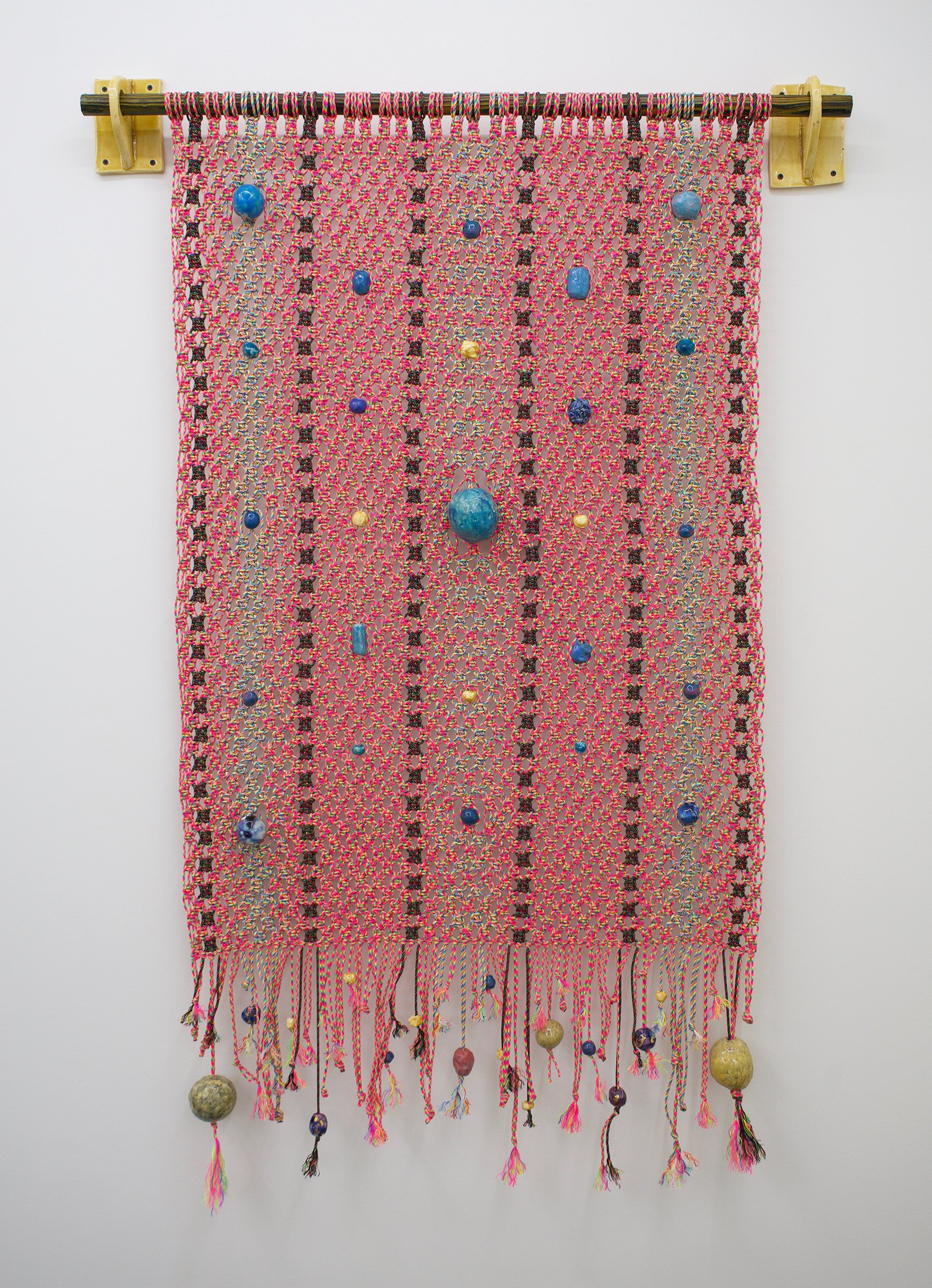   Pink Think , 2022 Paracord, glazed stoneware beads, glazed porcelain beads with gold luster, glazed stoneware wall mounts, charred and stained wood 72” x 48” 
