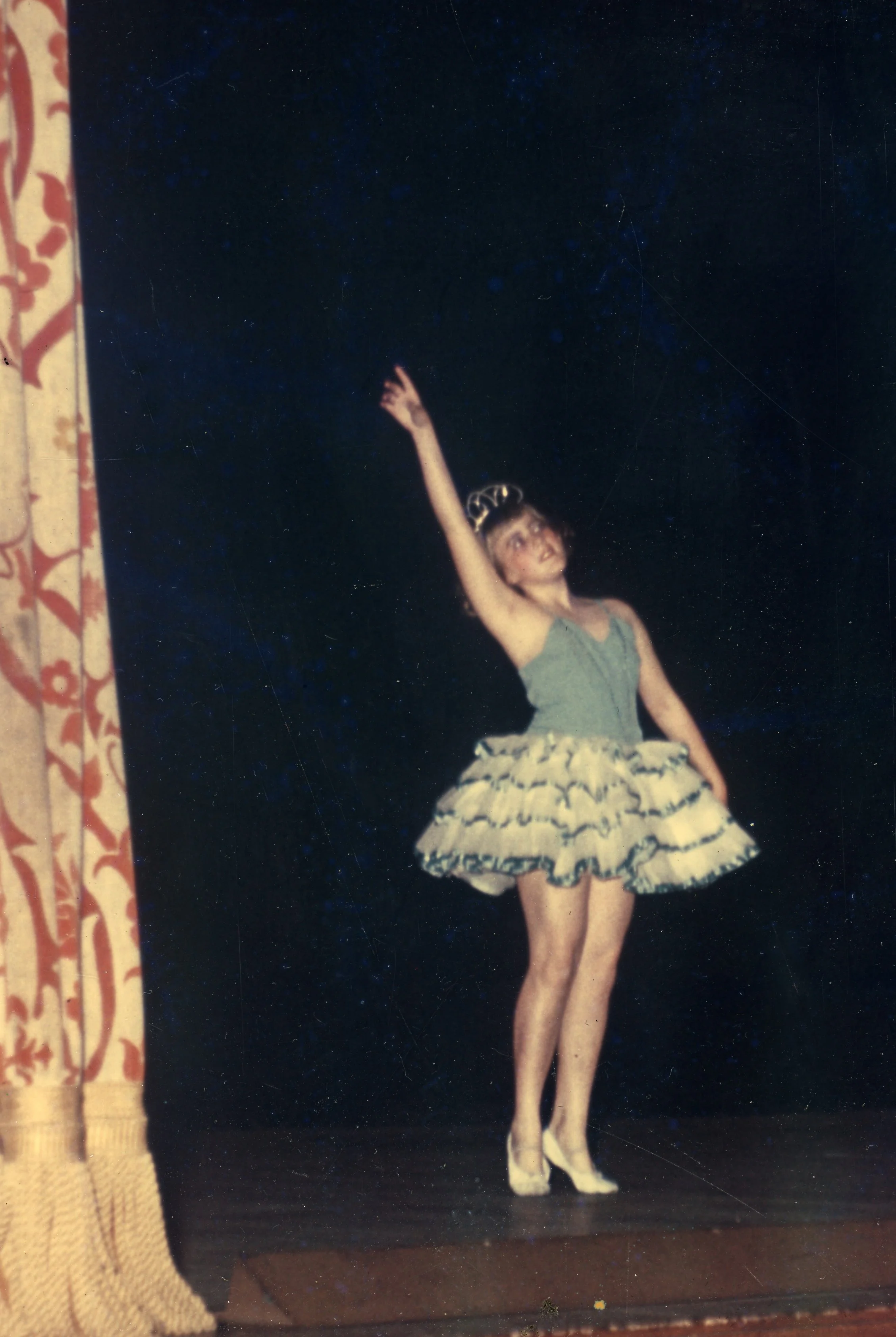 My favorite ballet costume -- rows of ruffles edged with satin ribbon and a sparkly tiara. I felt like a princess! 