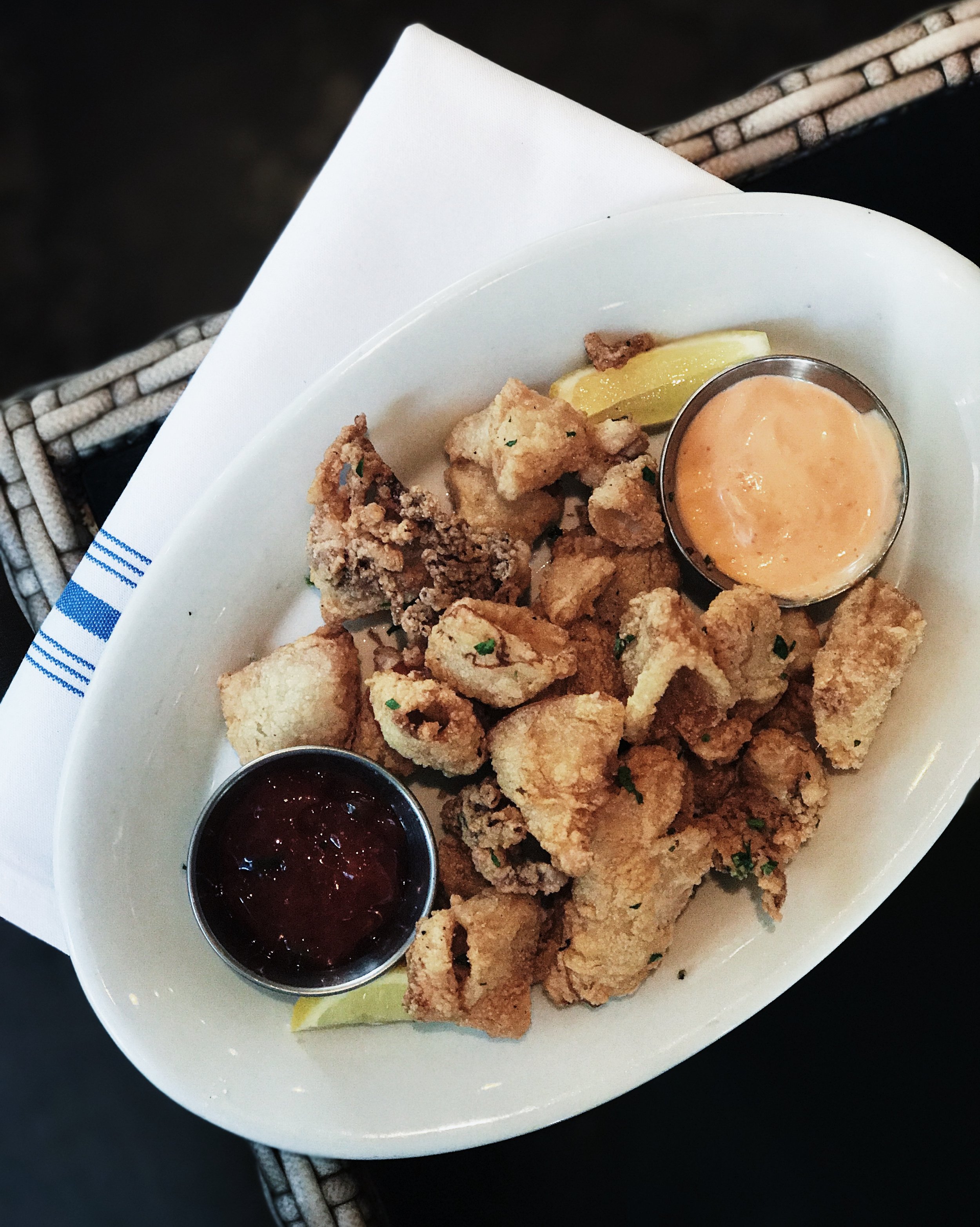 TOWN DOCK CALAMARI ($15) rhode islands premium, lightly breaded, chili aioli, house cocktail sauce