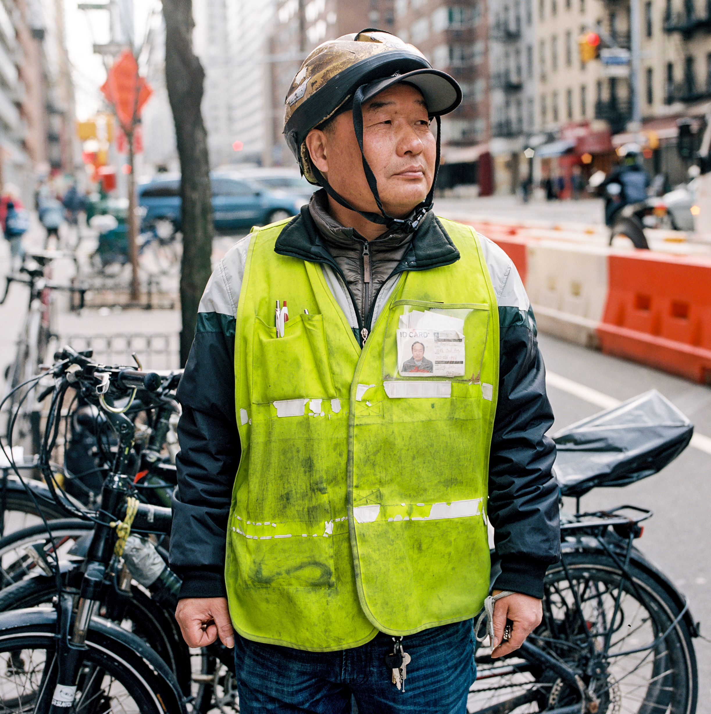  Ebike deliveryman Yang Hai stands beside his ride in Manhattan, February 2018. 