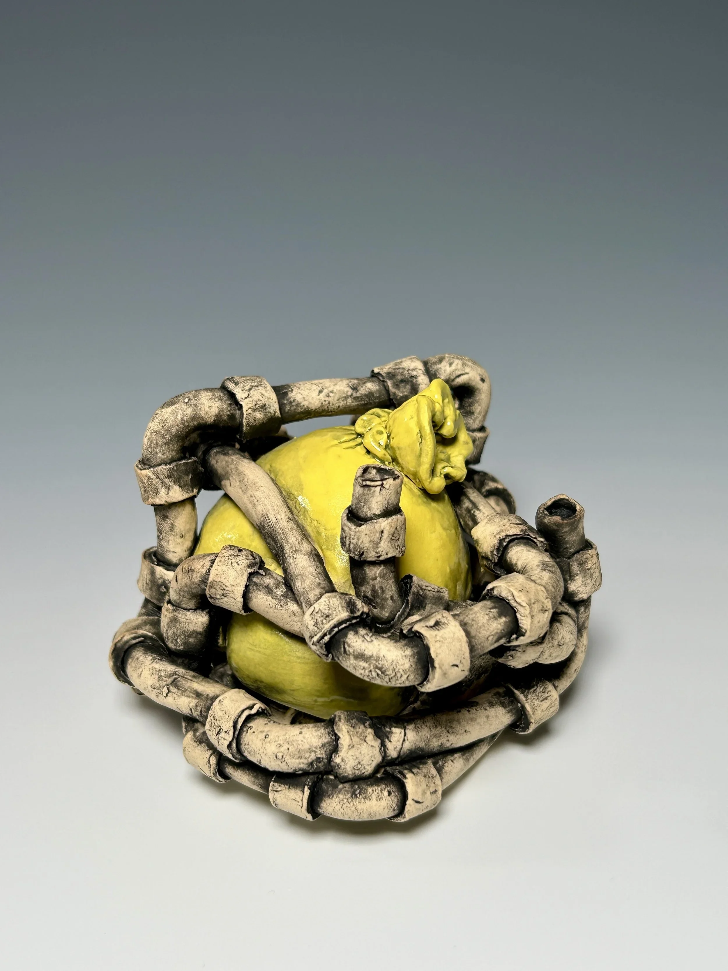 Inflated and Constrained, 2025 Ceramic with underglaze, glaze, and stains.  3.75” x 3.75” x 3.25”