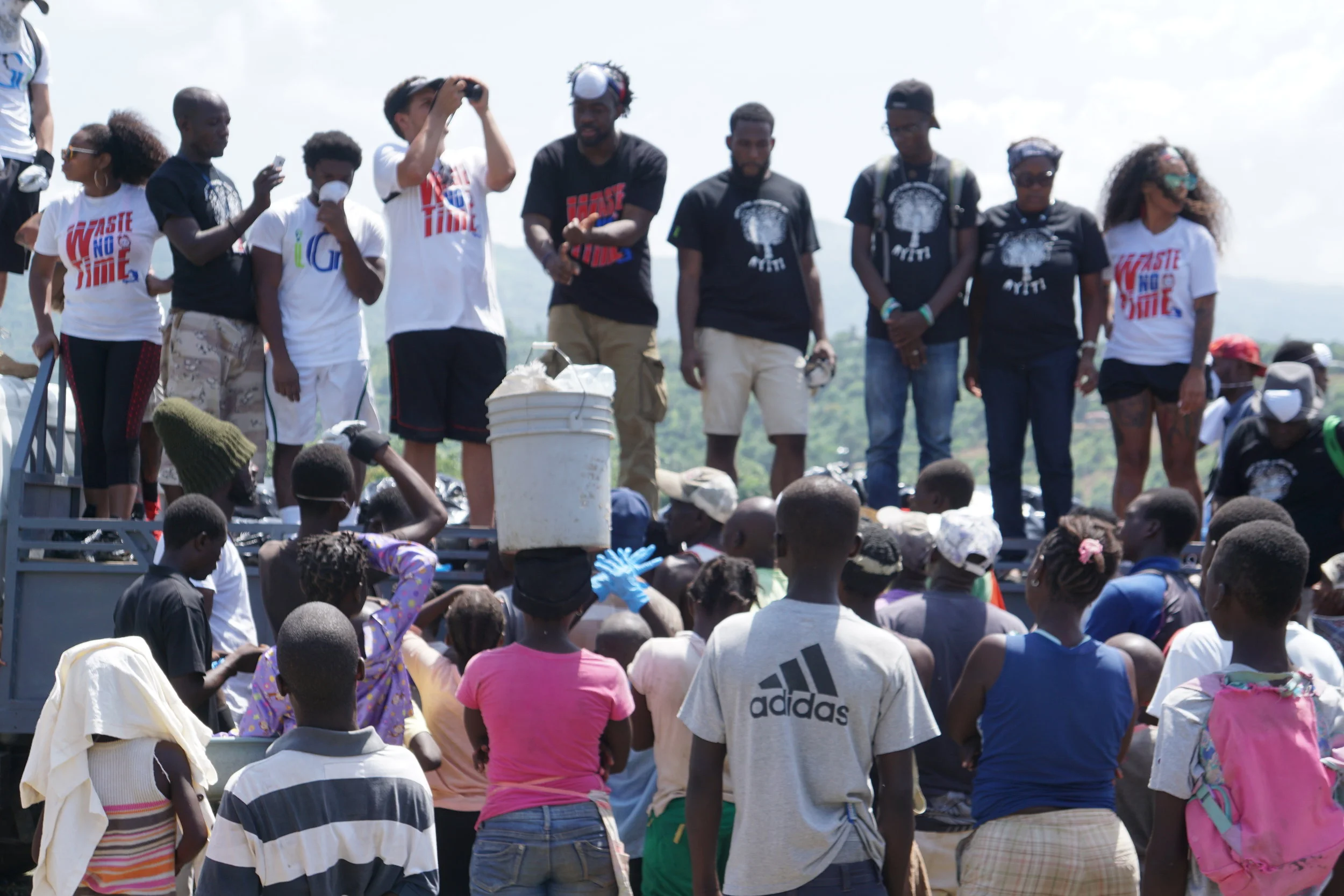 A group of our leaders speaking to the mass at an open public market, next to a dump, about proper waste disposal and the importance of preserving the environment. 