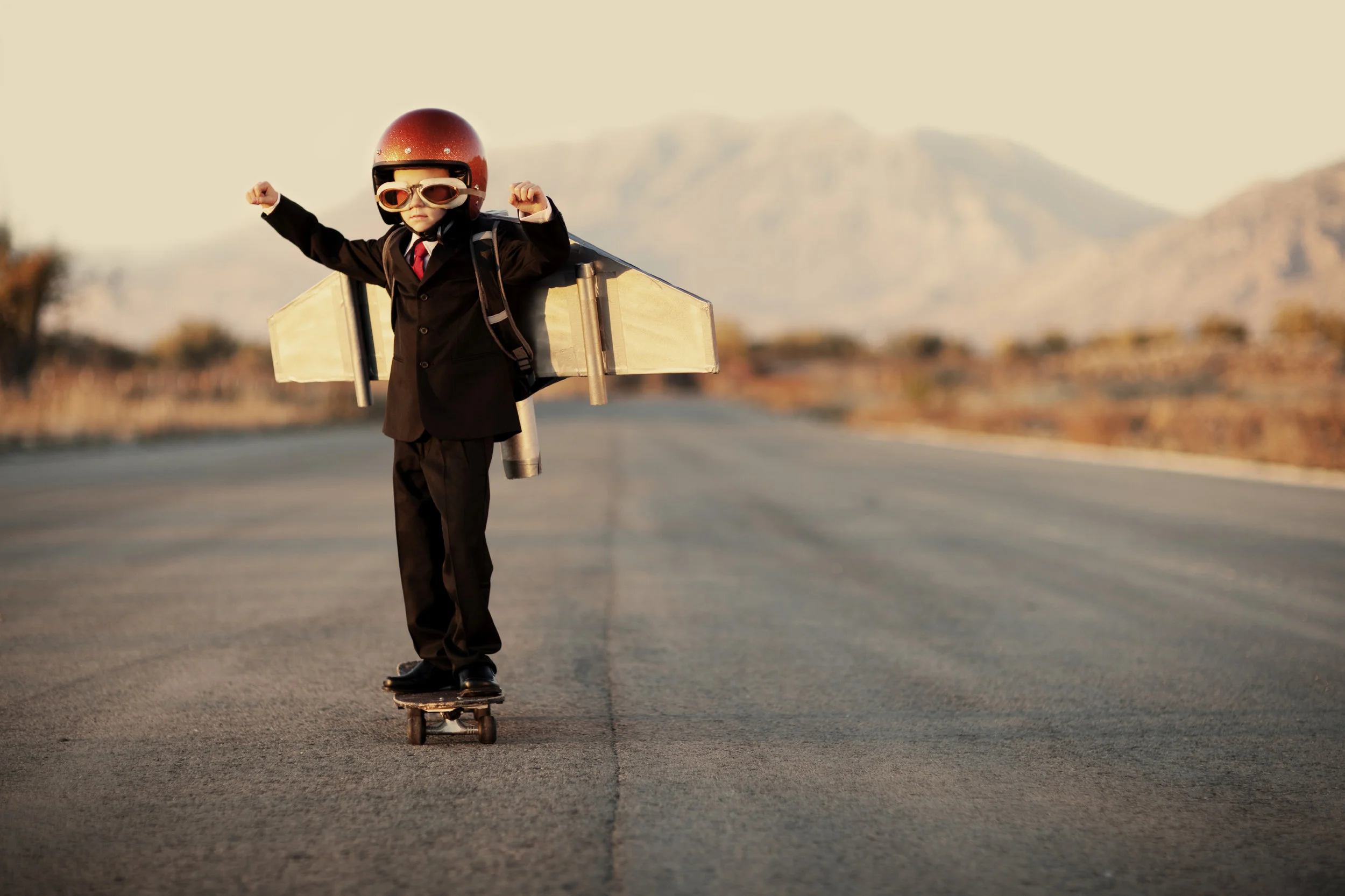 Young-Boy-Wearing-Business-Suit-and-Jet-Pack-000018254879_Large.jpg