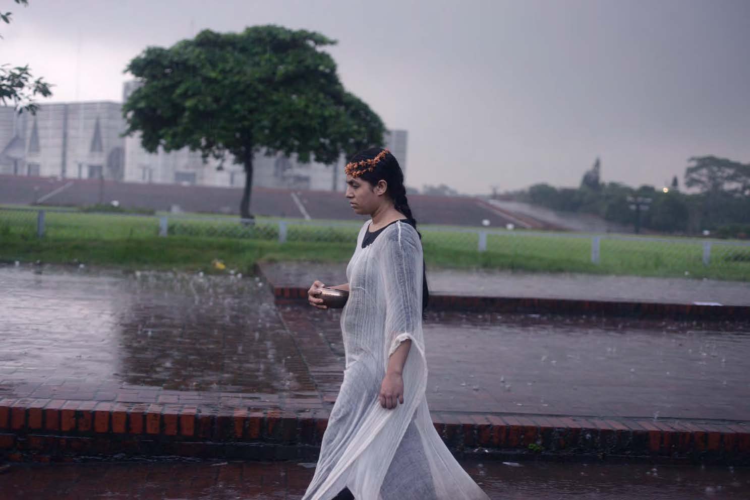 A Bird of Stone , a six-hour performance which involved walking from the US Embassy to Drik Picture Library, Dhaka, November 2014. Image courtesy: the artist. 