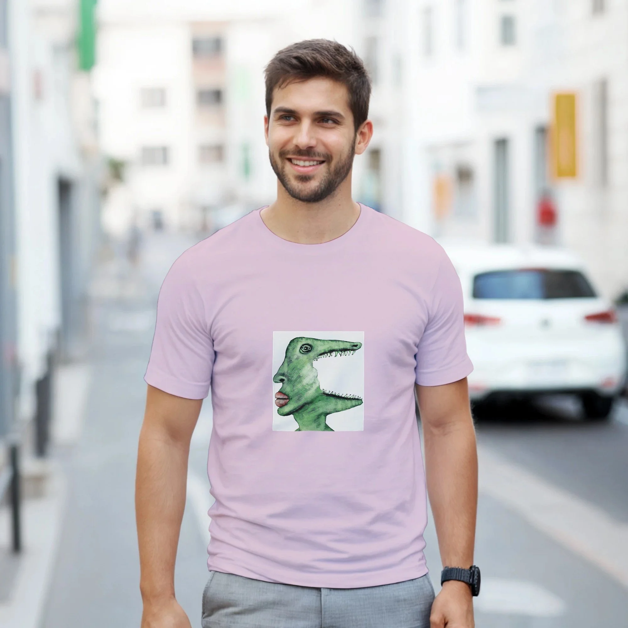 Unisex light pink t-shirt featuring a green surrealist crocodile art print by Roi Pajursky, modeled in various lifestyle settings.