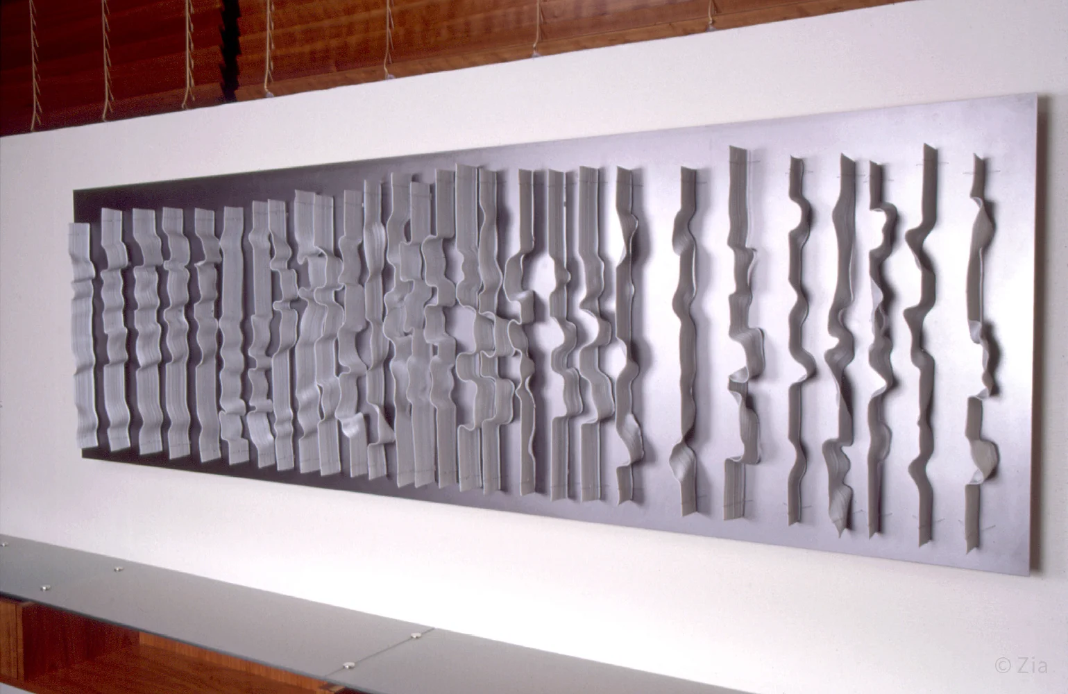    Between the Lines   80 x 24 x 3 inches / 200 x 60 x 6 cm porcelain, steel, stainless steel wire  elements are thrown on the ceramic wheel before shaping Commissioned by the Nordic Investment Bank, Helsinki Finland 