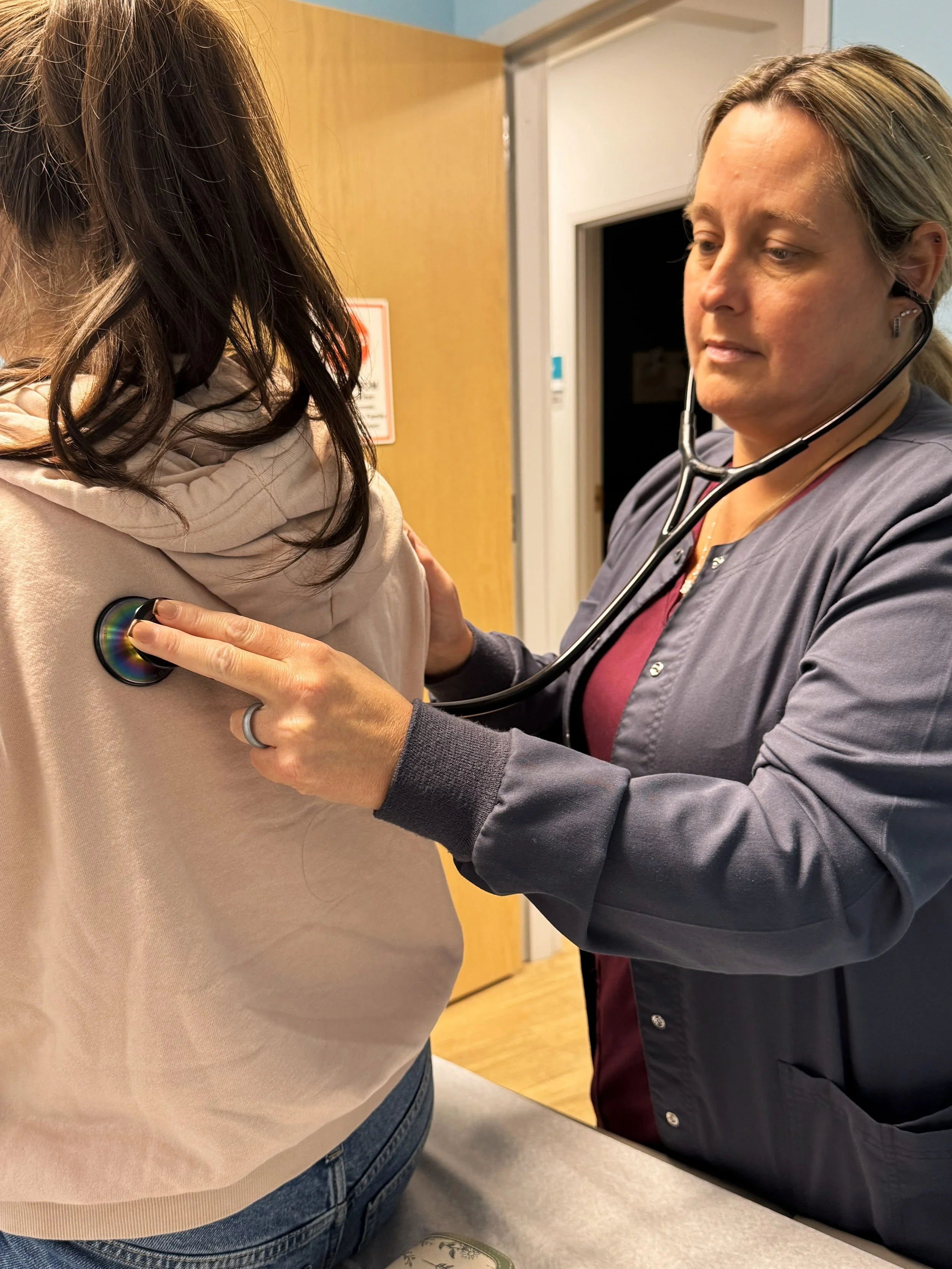 BVMI nurse with patient.jpg
