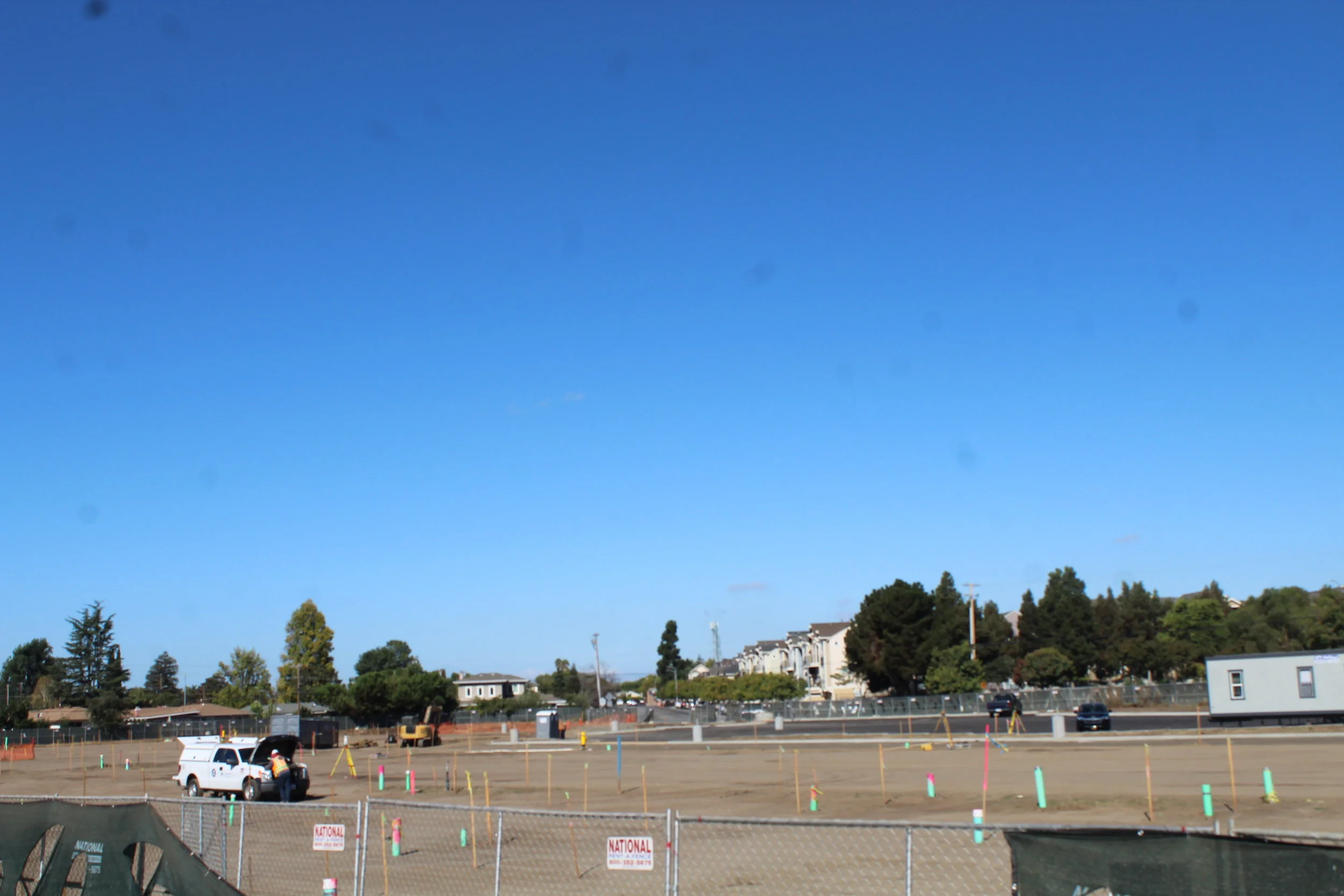 Watering the dirt because buildings grow from seeds