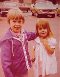 Me and my eventual husband in 1979, waiting on the Coronado Pier for our dads to come home from a deployment.