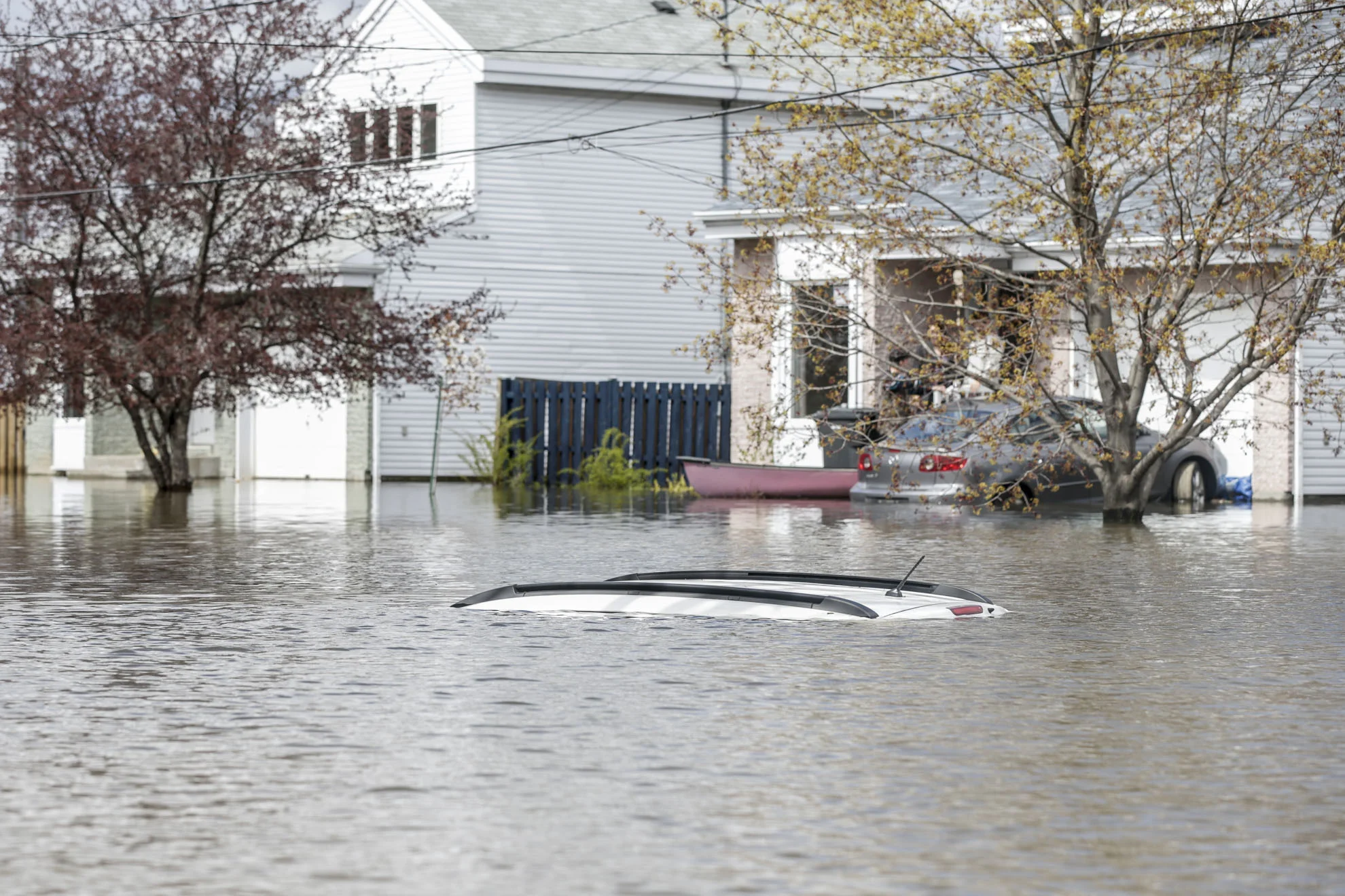  May 09, 2017 - Deux-Montagnes, Quebec, Canada: A car is completly flooded in a neighbourhood of Deux-Montagnes, (Normand Blouin/Polaris) 